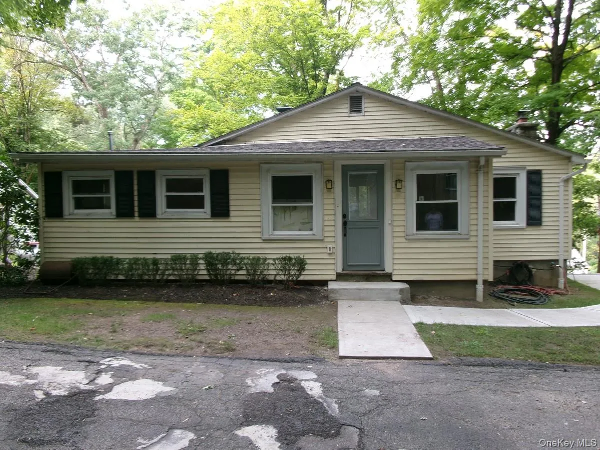 Who would have thought that behind this unassuming front entrance lie captivating architectural features and custom carpentry! Who would have thought that behind this unassuming front entrance lie captivating architectural features and custom carpentry!