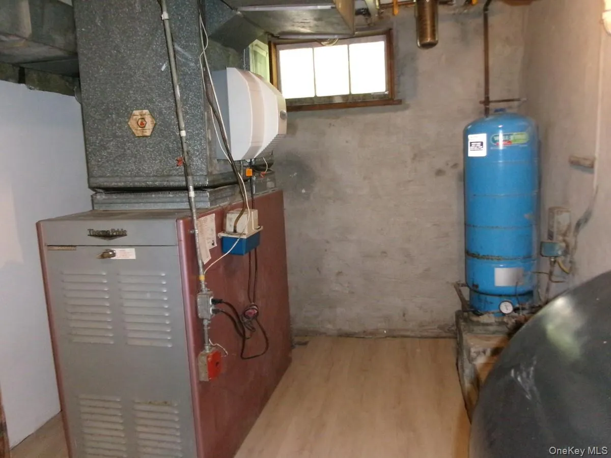 Utilities Room contains the furnace, an oil tank and water treatment apparatus.. Utilities Room contains the furnace, an oil tank and water treatment apparatus..