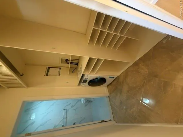 Custom Build Walk-Through Closet with Washer/Dryer Combo Custom Build Walk-Through Closet with Washer/Dryer Combo