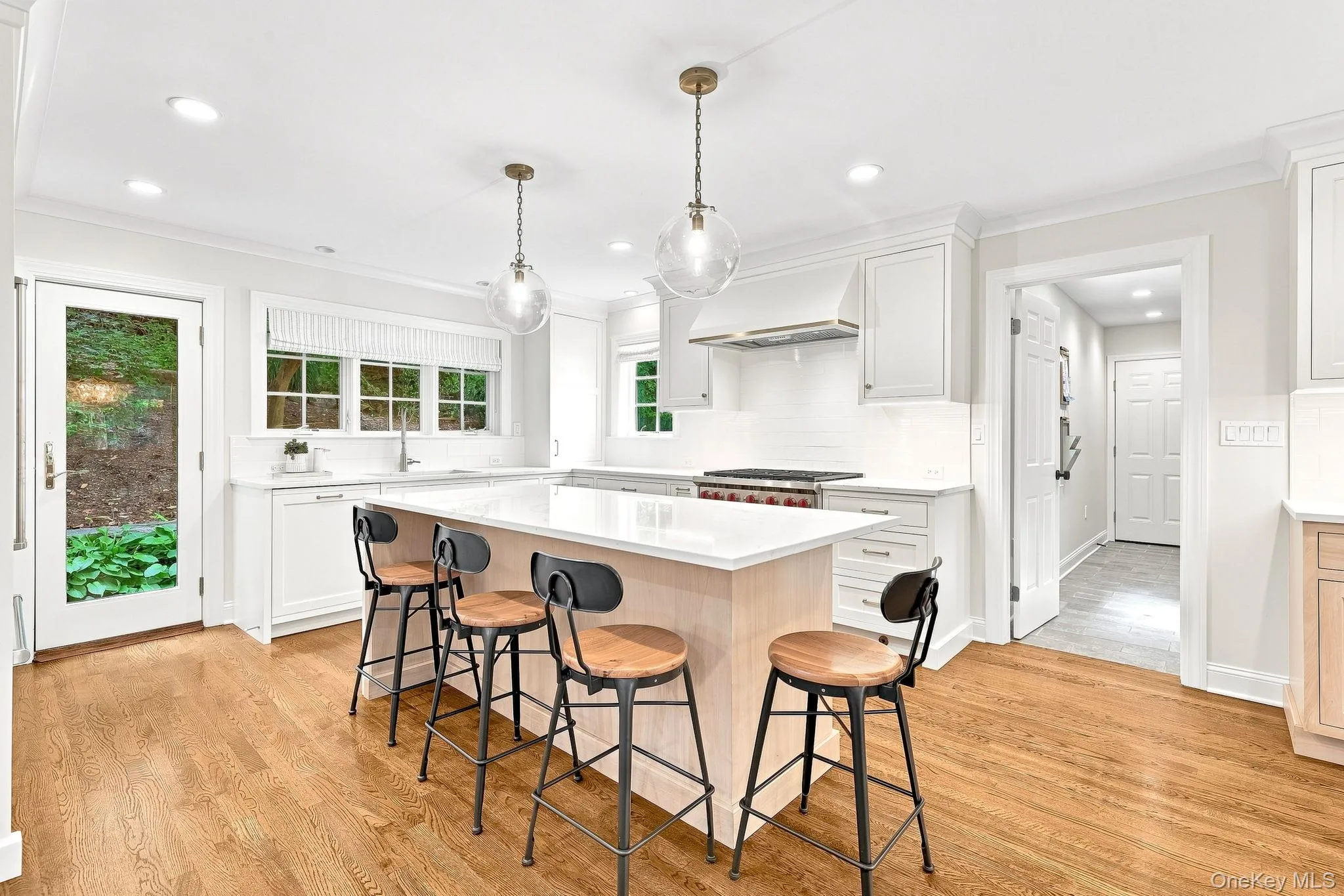 Center Island with Seating and Doors to Yard and Mudroom Center Island with Seating and Doors to Yard and Mudroom