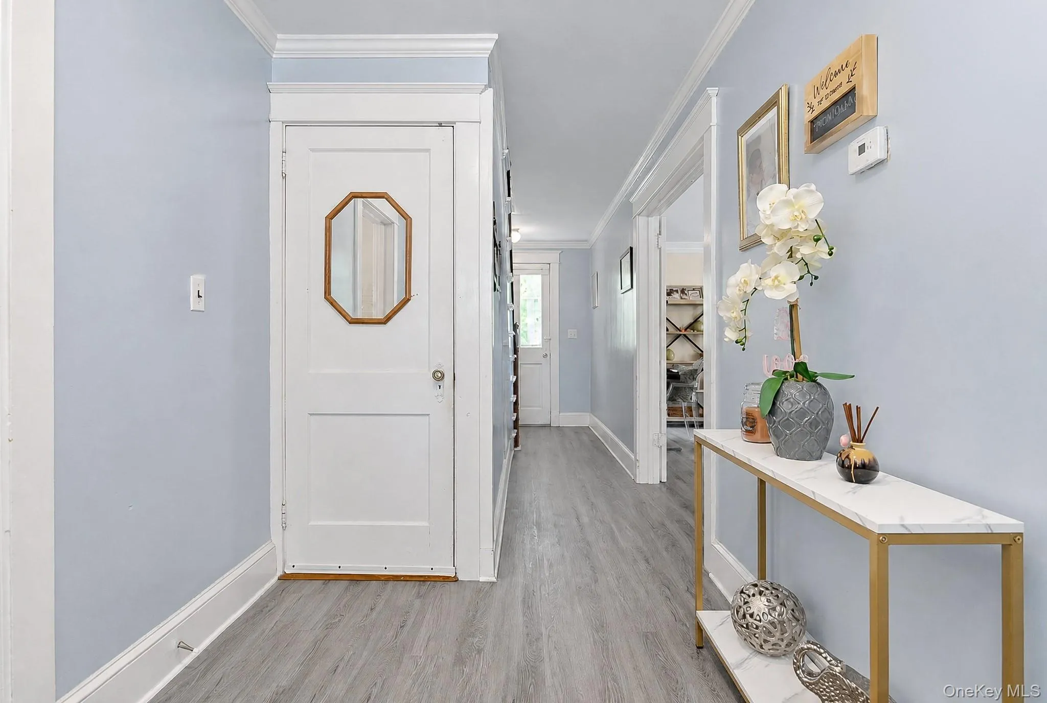 Front entry foyer. There are fir floors in need of repair underneath the pergo flooring. Front entry foyer. There are fir floors in need of repair underneath the pergo flooring.