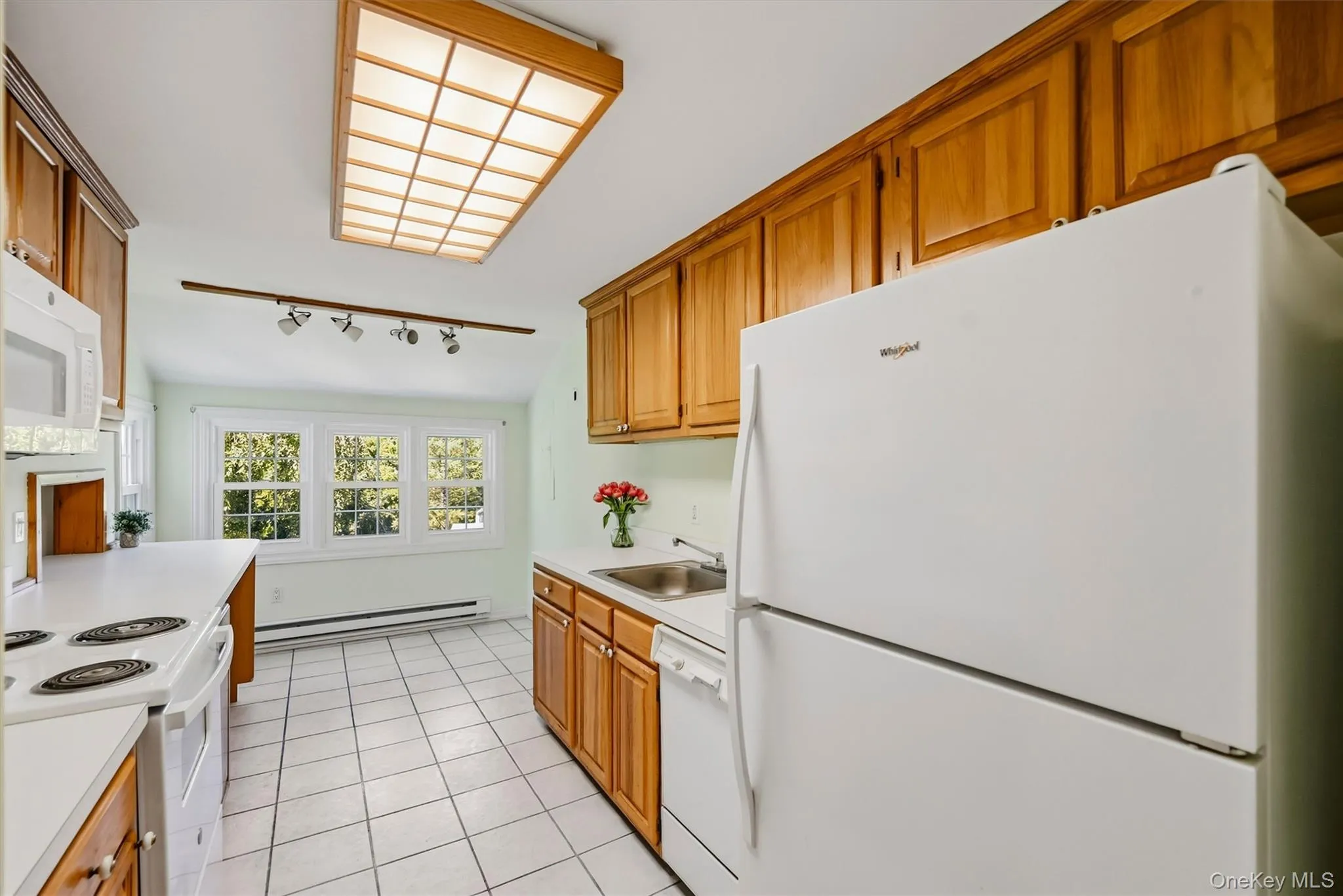 Nicely updated eat in kitchen with plenty of cabinetry and new microwave Nicely updated eat in kitchen with plenty of cabinetry and new microwave