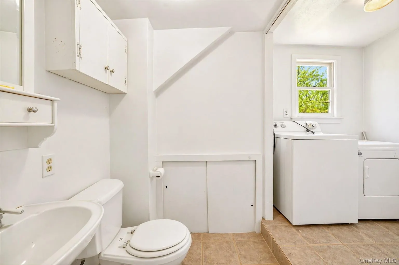Powder room and laundry area. Powder room and laundry area.