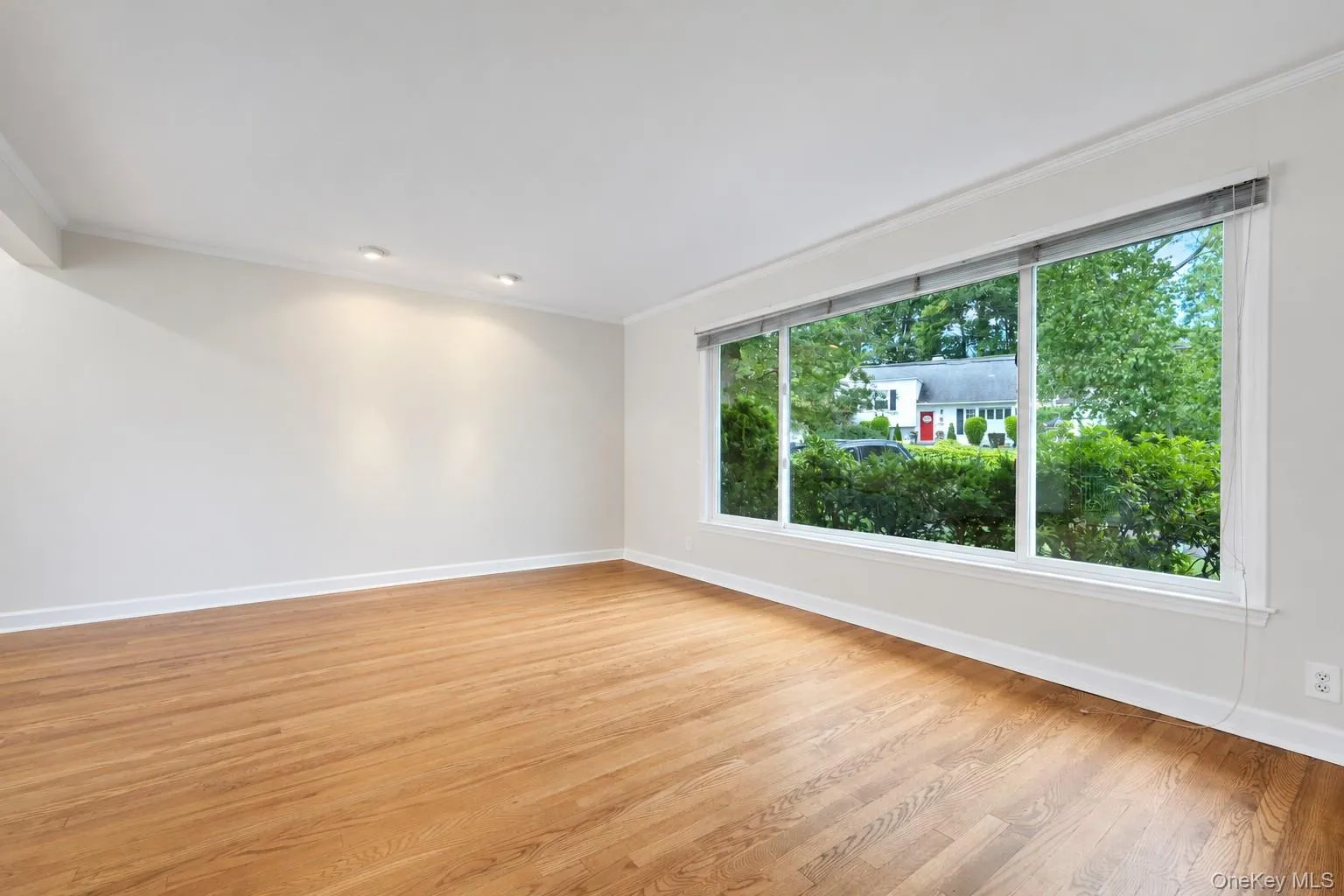 Living room with large window. Plenty of sunlight. Living room with large window. Plenty of sunlight.