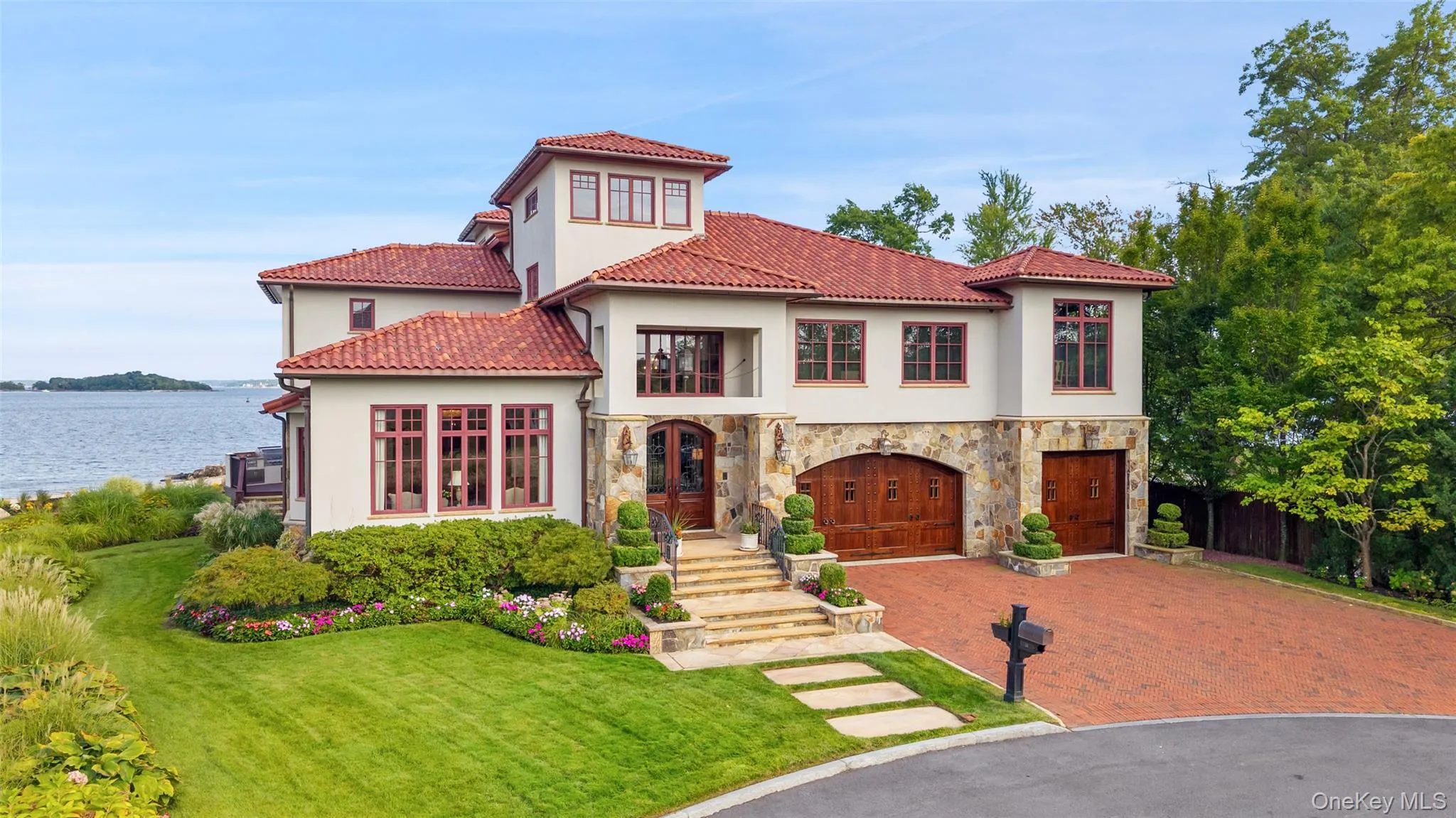 Front view of waterfront home. Front view of waterfront home.