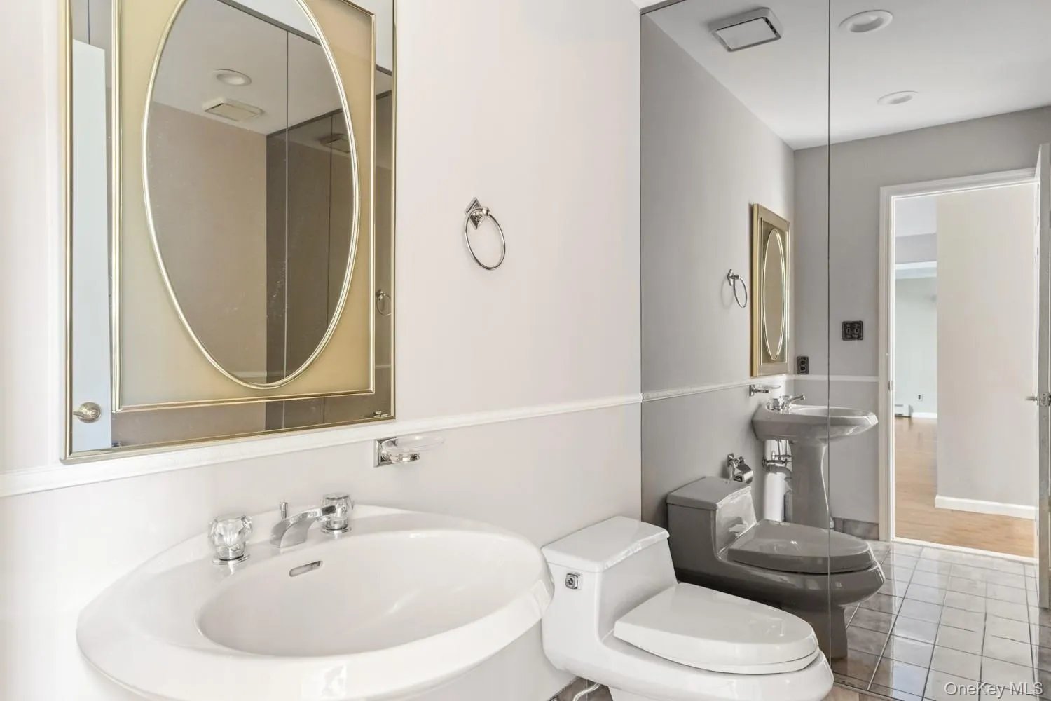 Powder Room featuring toilet and tile patterned flooring Powder Room featuring toilet and tile patterned flooring