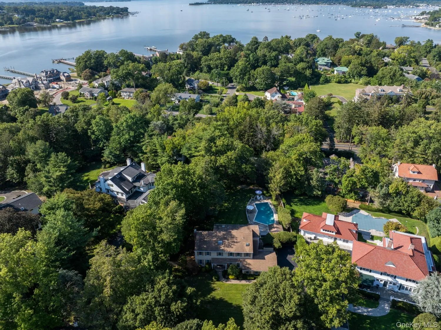 View of property location featuring a nearby body of water and nearby suburban area View of property location featuring a nearby body of water and nearby suburban area