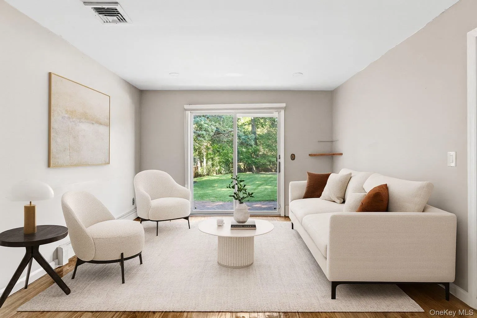 Living room featuring wood finished floors and baseboards Living room featuring wood finished floors and baseboards
