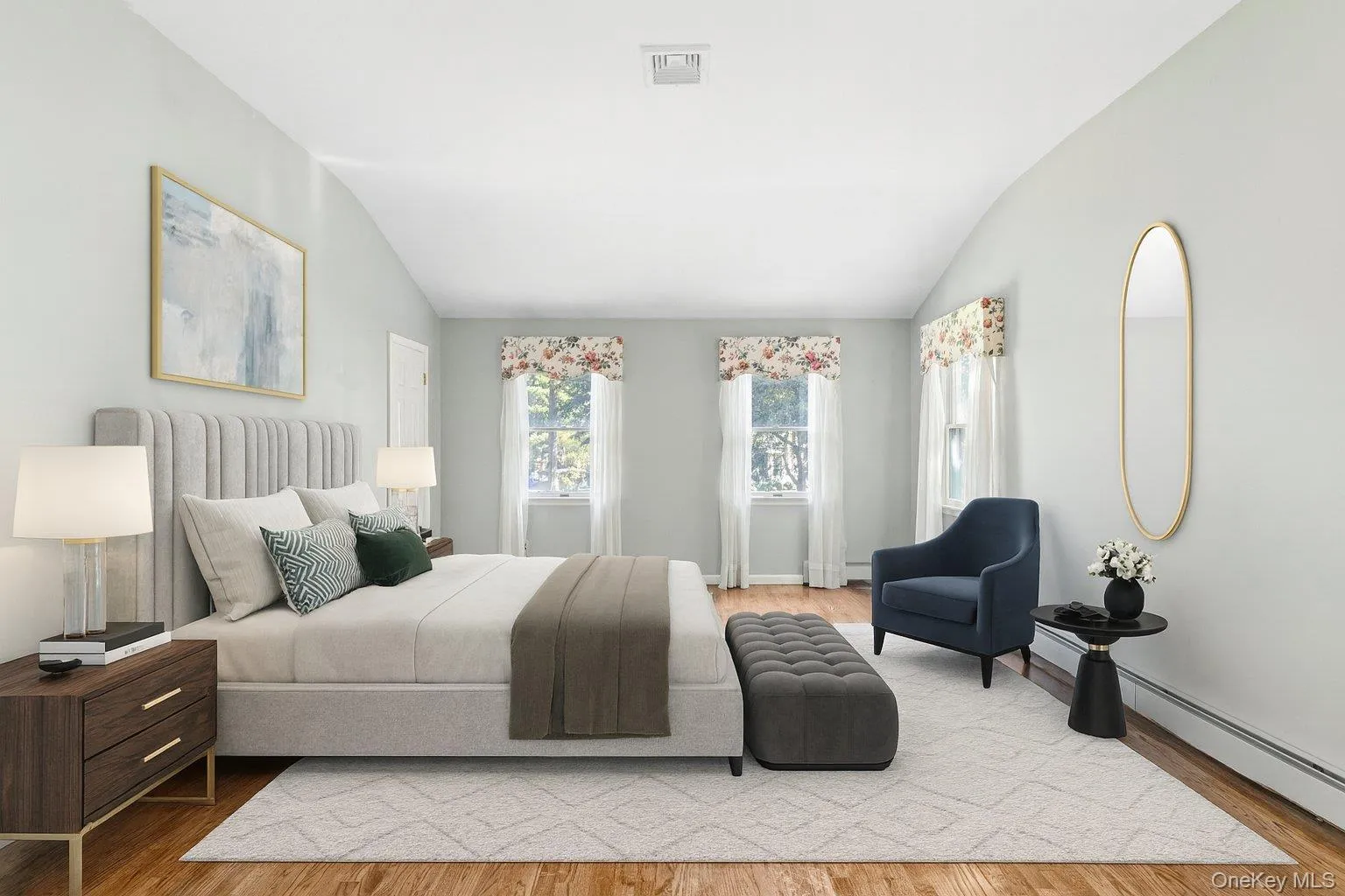 Bedroom with lofted ceiling, wood finished floors, a baseboard radiator, and baseboard heating Bedroom with lofted ceiling, wood finished floors, a baseboard radiator, and baseboard heating
