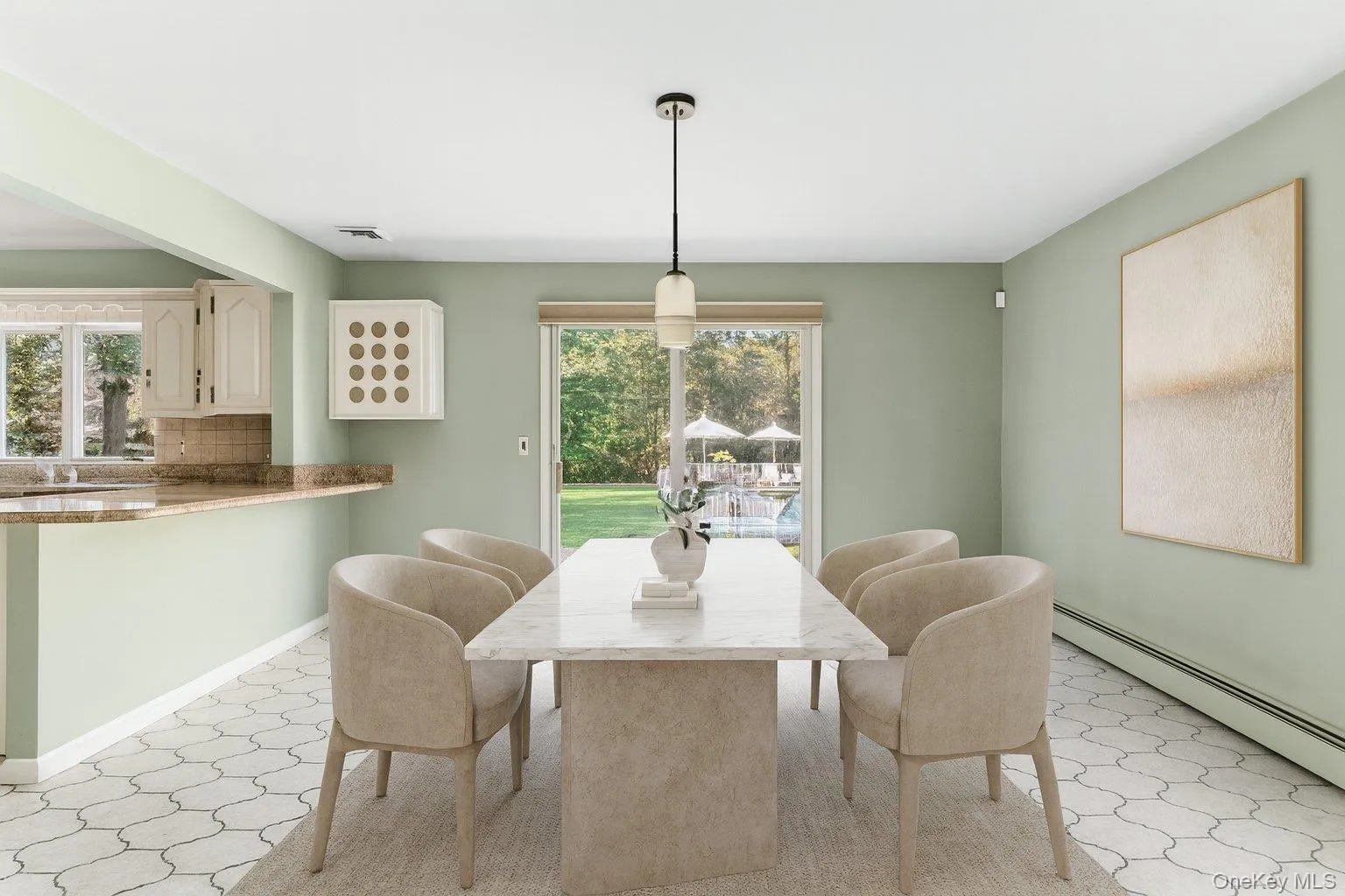 Dining room featuring light flooring and baseboard heating Dining room featuring light flooring and baseboard heating