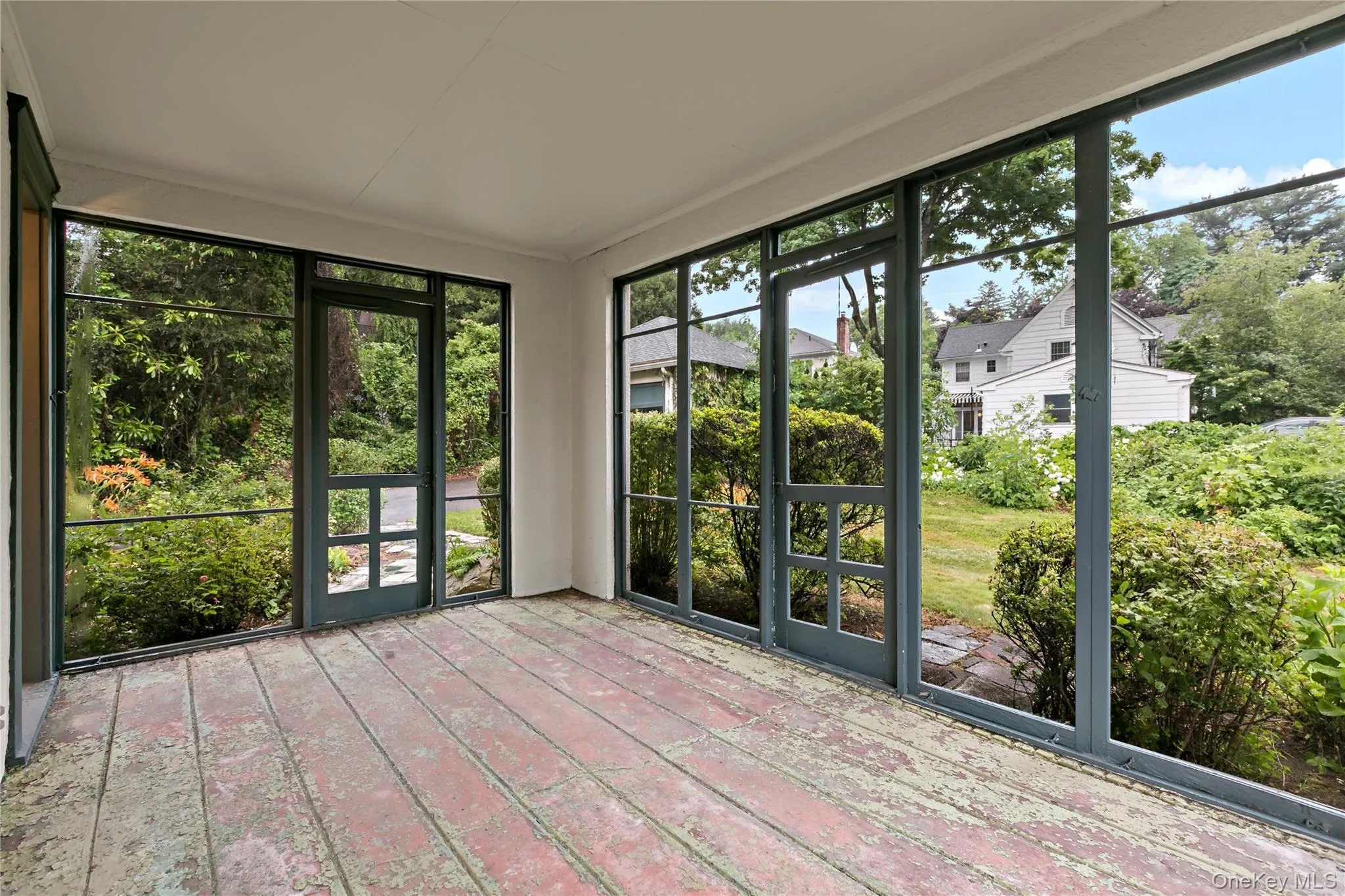Screened in porch off Dining Room with door to backyard Screened in porch off Dining Room with door to backyard