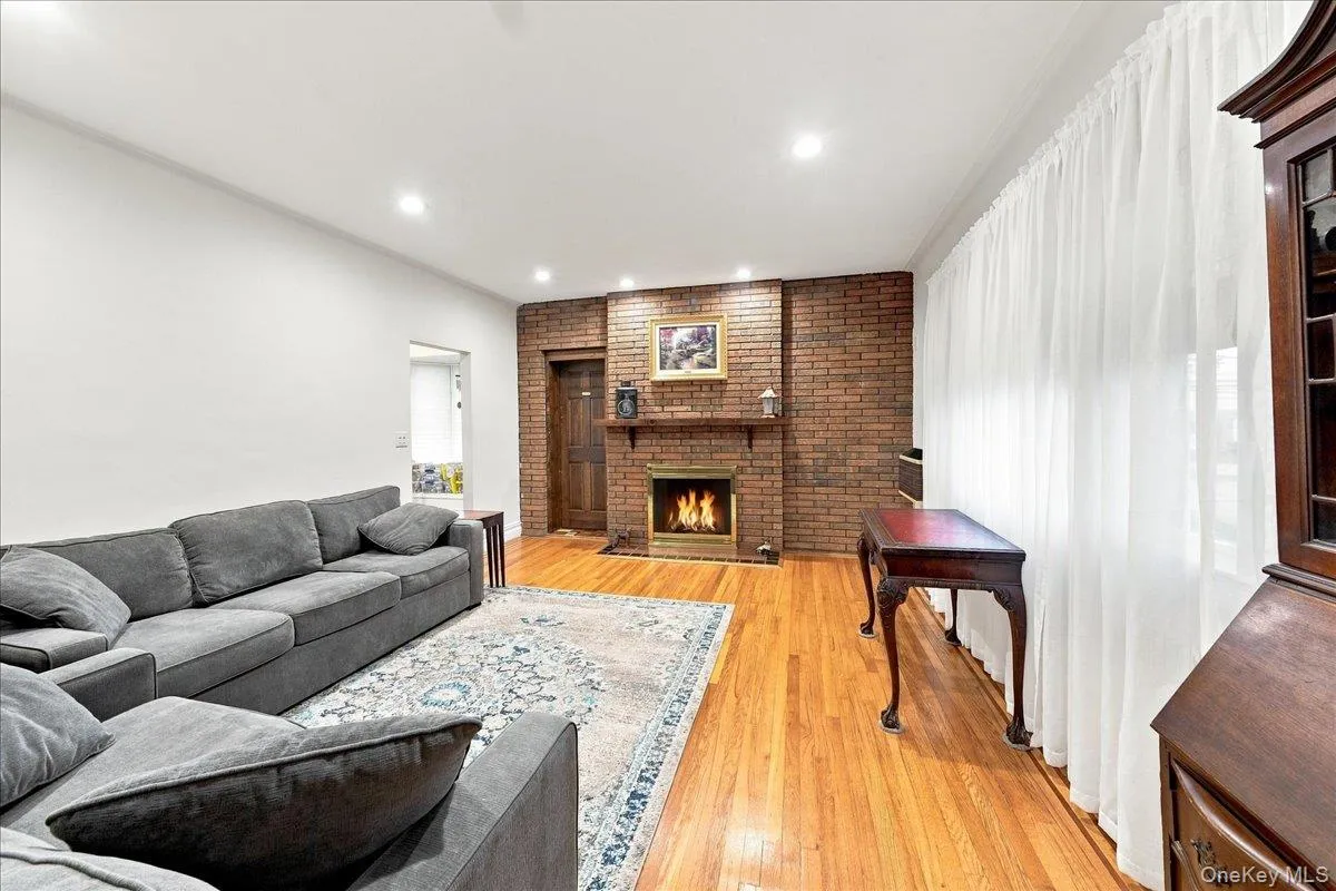 with beautiful hardwood floors with a fireplace with beautiful hardwood floors with a fireplace