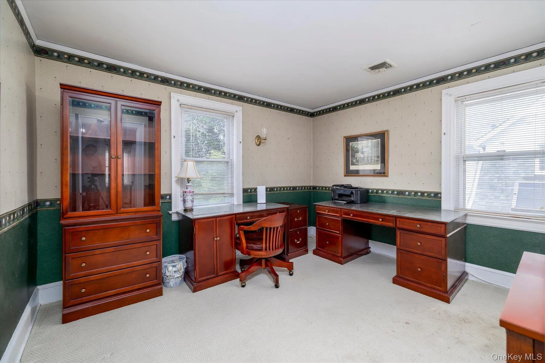 Bedroom being used as a home office with laundry. Bedroom being used as a home office with laundry.