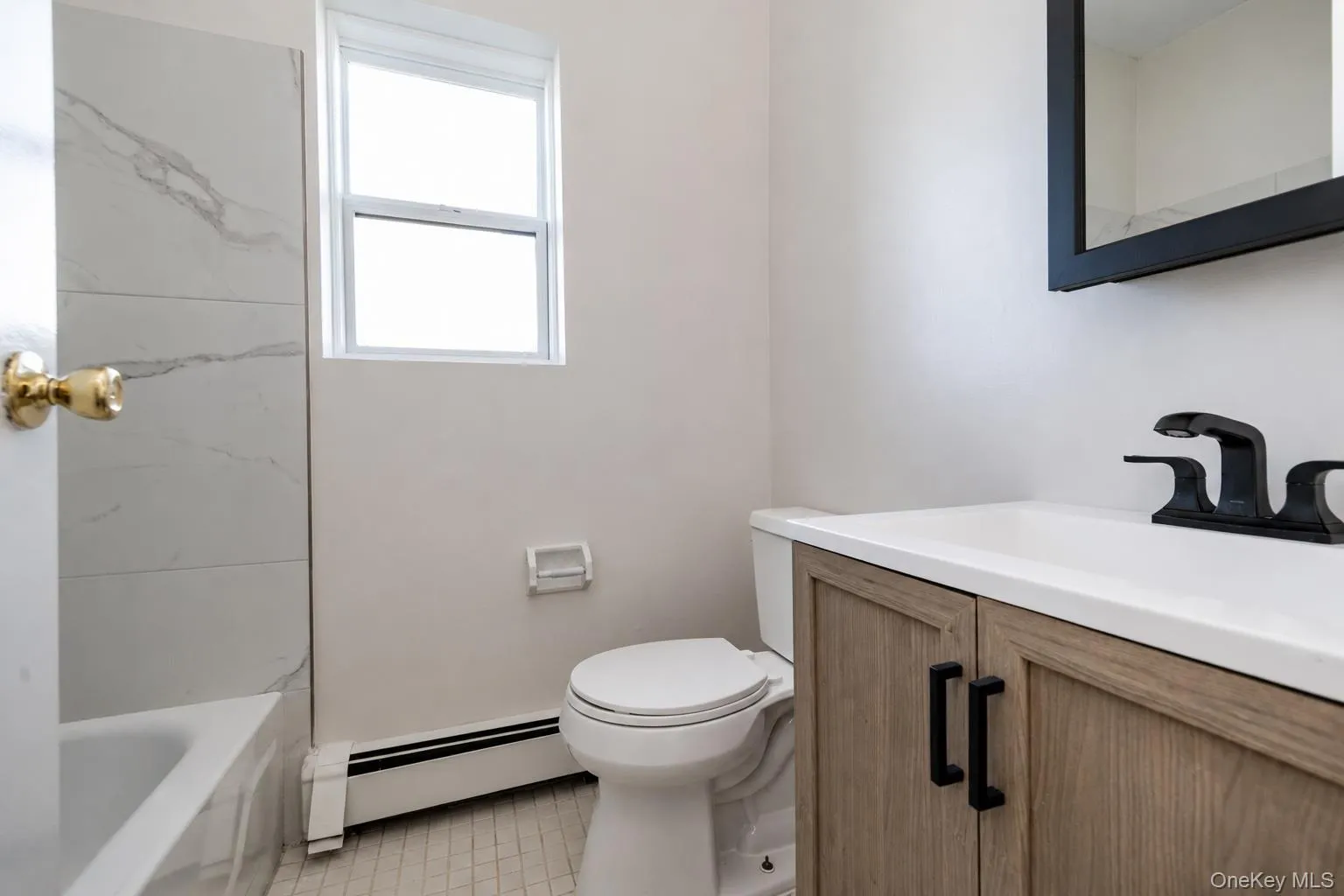 Updated bath with new vanity and full tub. Updated bath with new vanity and full tub.