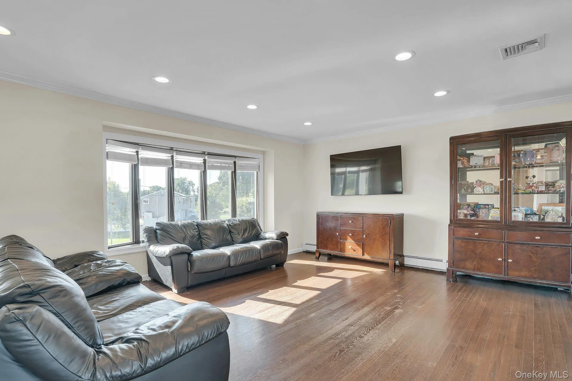 Large living room with casement windows. Large living room with casement windows.