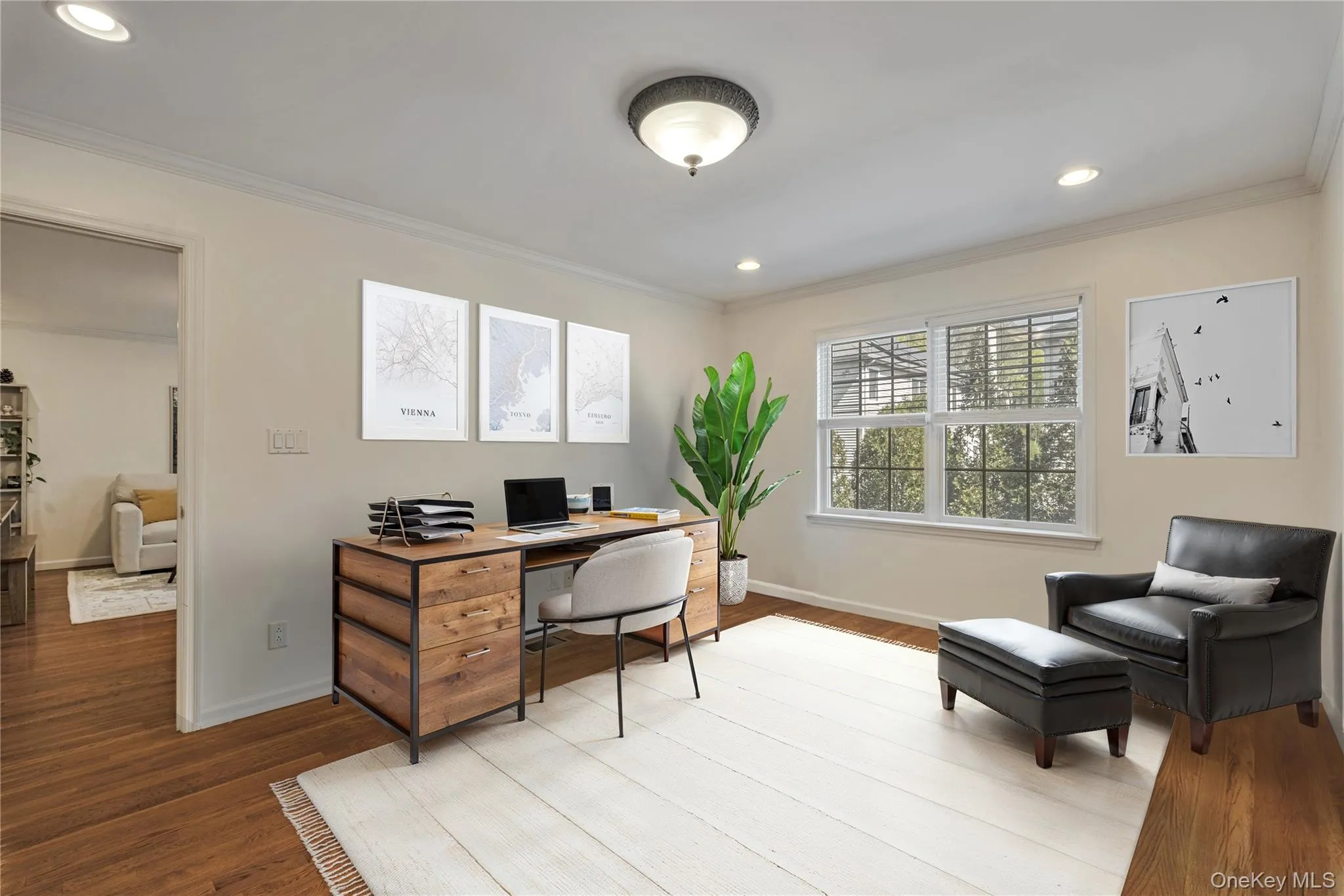 Home office featuring ornamental molding, wood finished floors, and recessed lighting Home office featuring ornamental molding, wood finished floors, and recessed lighting