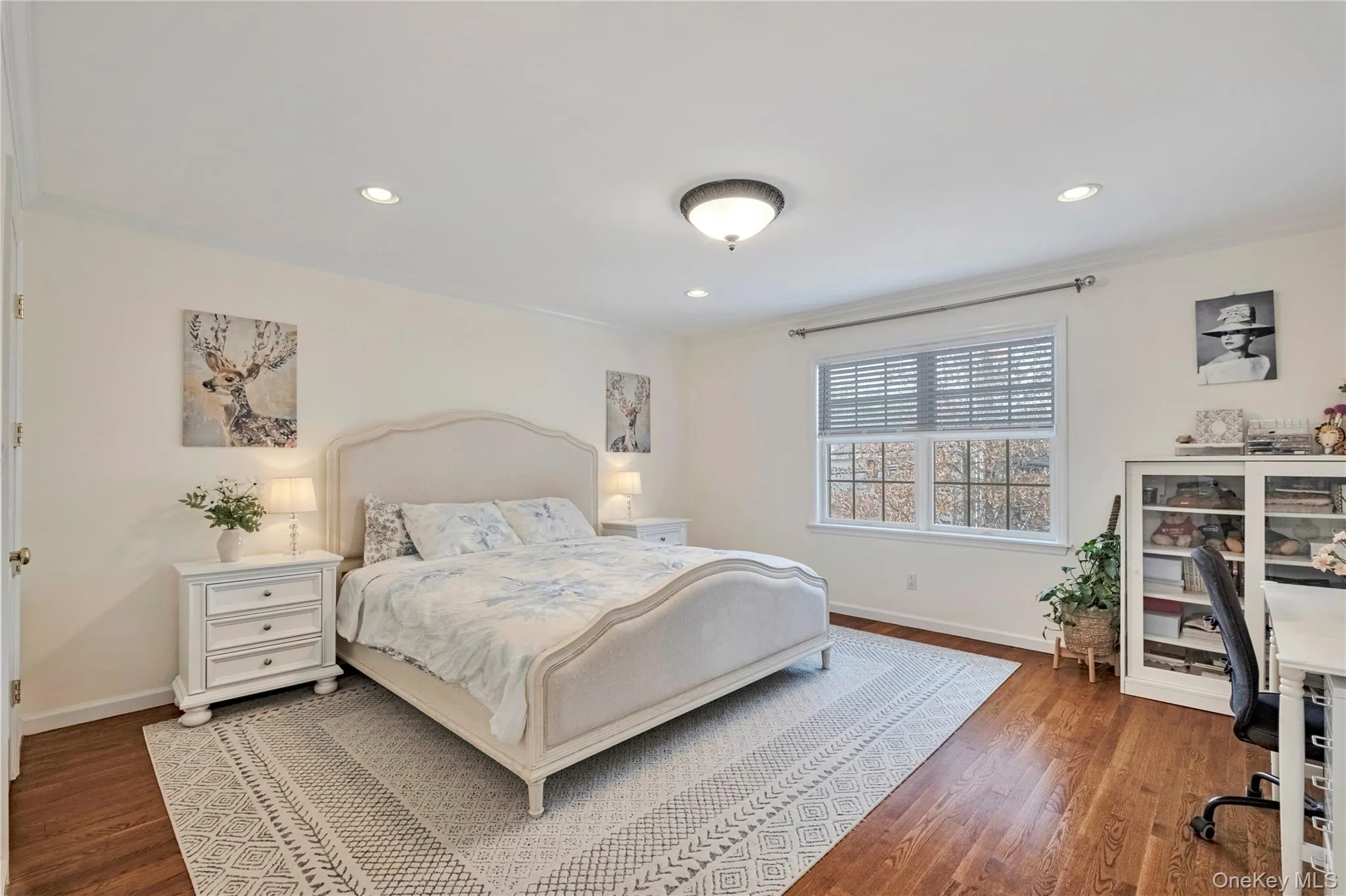 Bedroom featuring wood finished floors, ornamental molding, a desk, and recessed lighting Bedroom featuring wood finished floors, ornamental molding, a desk, and recessed lighting