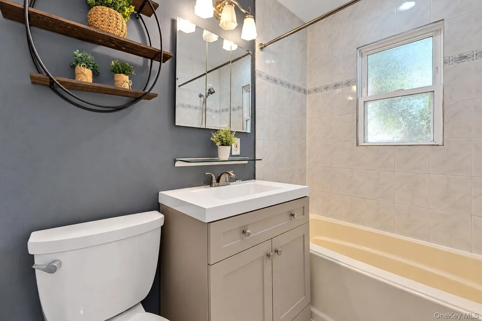 Updated bathroom on the main level with tub and window Updated bathroom on the main level with tub and window