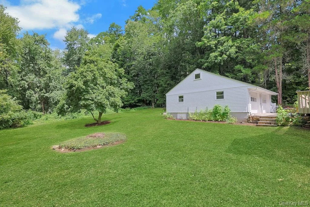 A beautiful view of the expansive, level yard, offering plenty of space for outdoor entertaining and recreation! A beautiful view of the expansive, level yard, offering plenty of space for outdoor entertaining and recreation!
