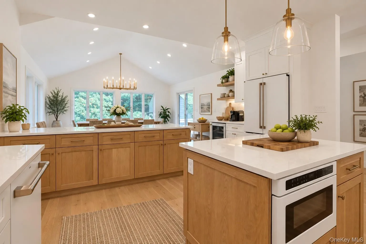 Another view of this spacious eat-kitchen, showcasing its generous layout, abundant counter space, and inviting dining area. Another view of this spacious eat-kitchen, showcasing its generous layout, abundant counter space, and inviting dining area.