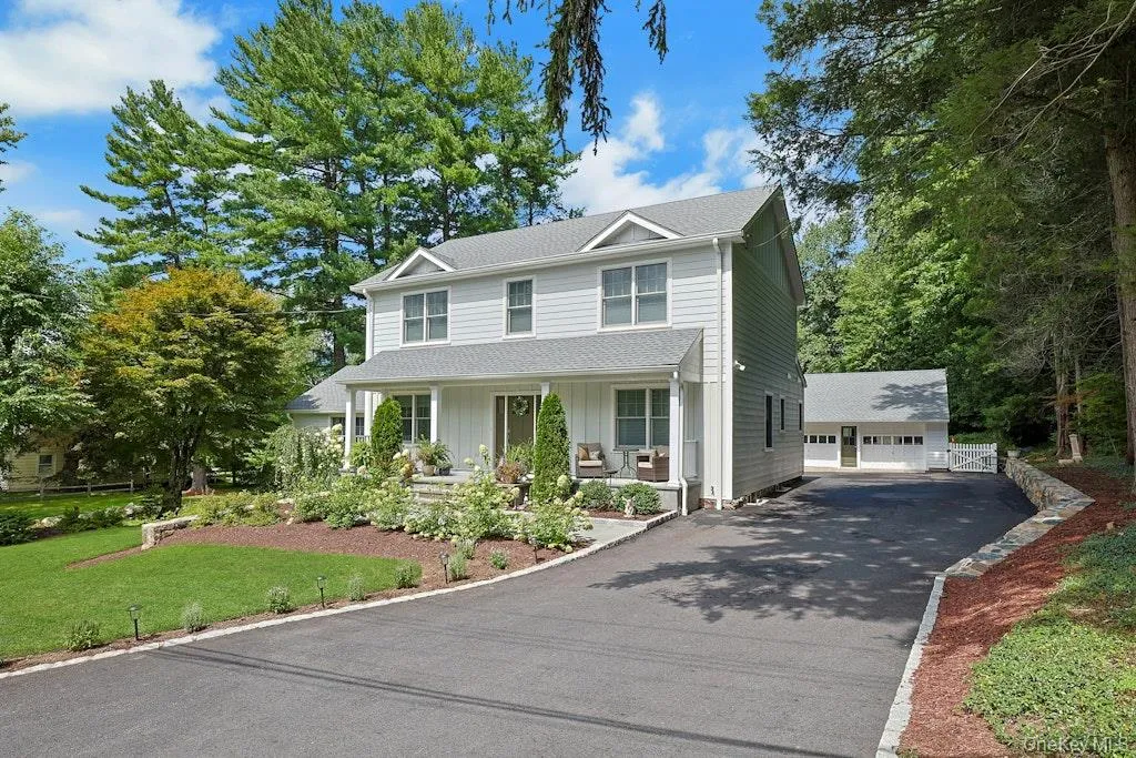 A beautiful view showcasing the home’s inviting front porch, charming exterior, and wonderful curb appeal. A beautiful view showcasing the home’s inviting front porch, charming exterior, and wonderful curb appeal.