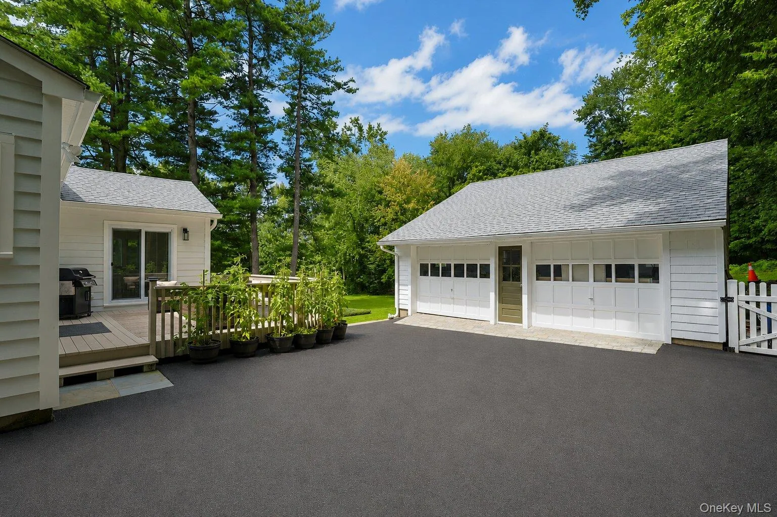View of the deck and this large driveway! View of the deck and this large driveway!