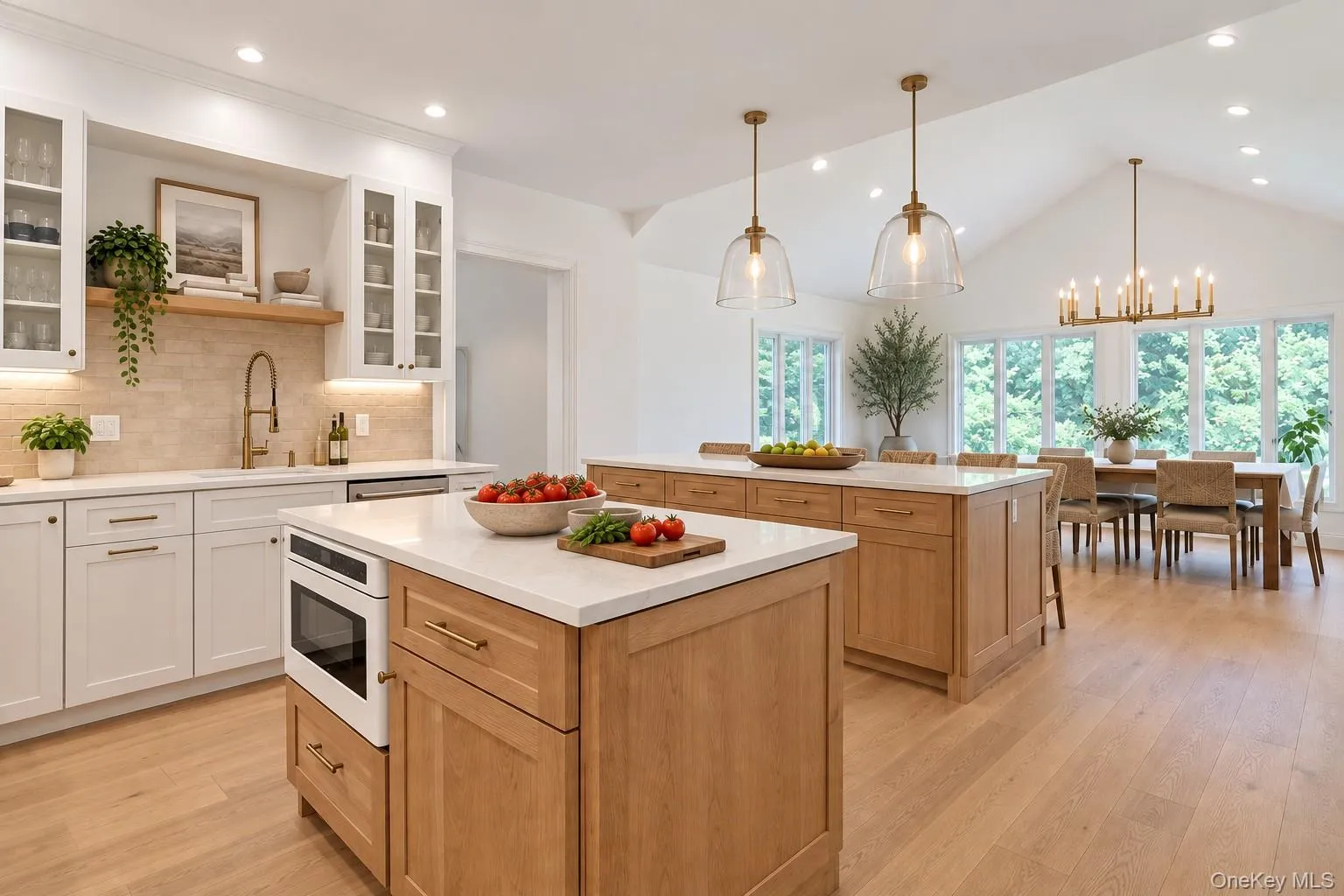 Virtually staged with a chandelier and pendant lighting, this spacious eat-in kitchen features two generous countertops, perfect for cooking, entertaining and gathering. Virtually staged with a chandelier and pendant lighting, this spacious eat-in kitchen features two generous countertops, perfect for cooking, entertaining and gathering.