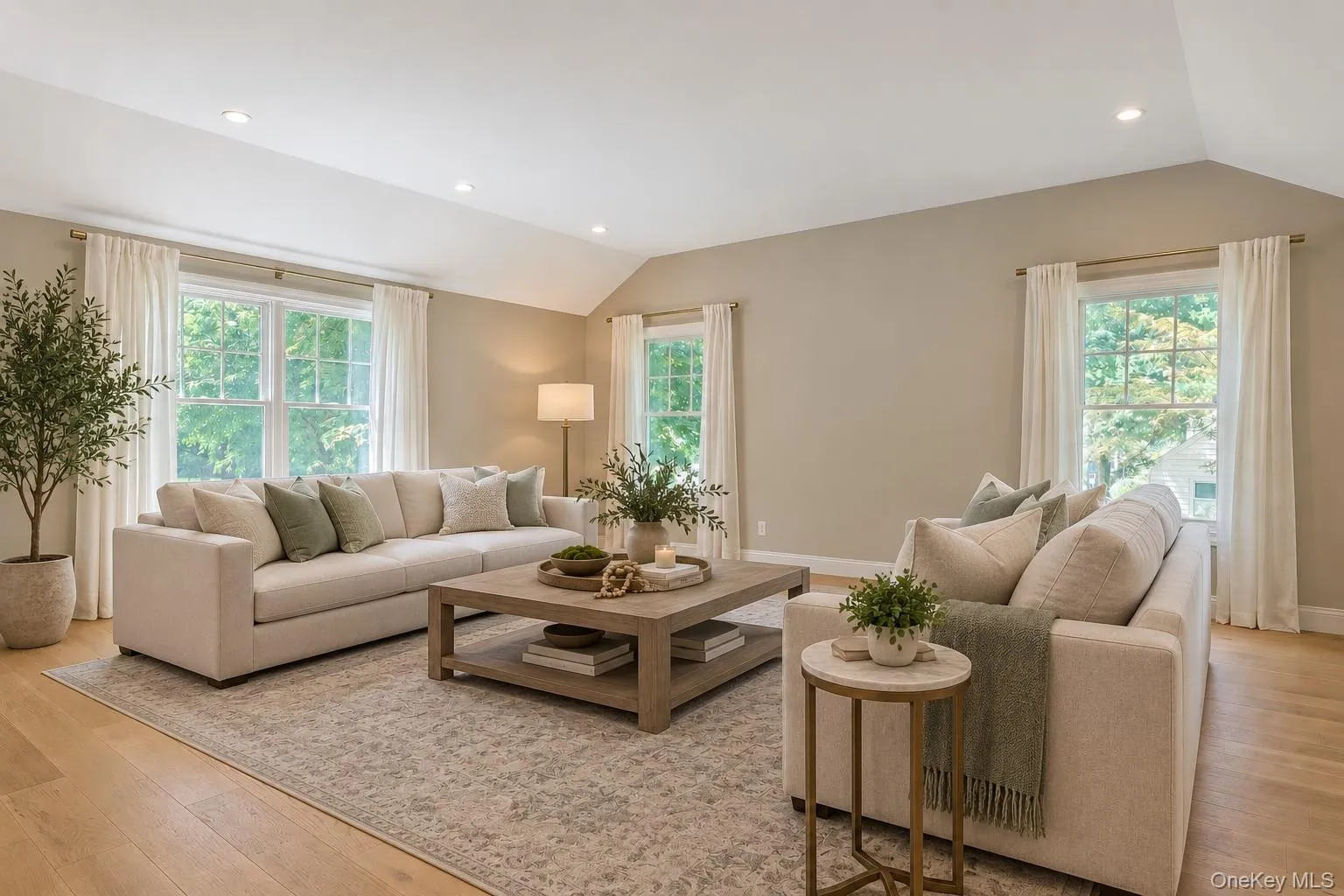 Bright, and spacious family room featuring and abundance of windows that fill the space with natural light, creating a warm and inviting atmosphere. Bright, and spacious family room featuring and abundance of windows that fill the space with natural light, creating a warm and inviting atmosphere.
