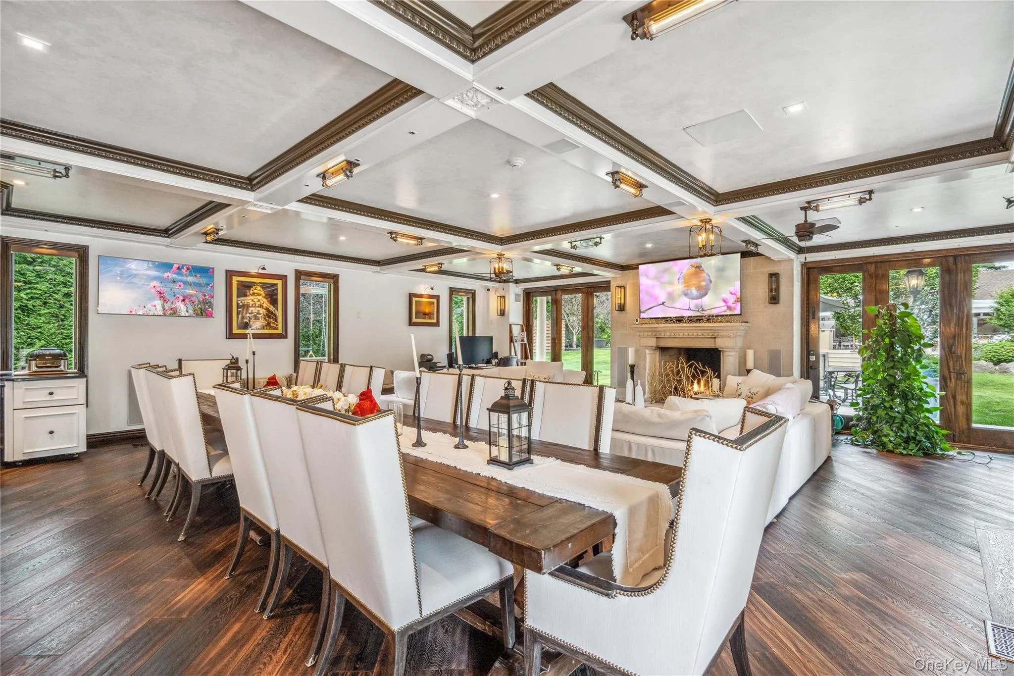Enormous great room with dining area and accordion glass doors to the patio Enormous great room with dining area and accordion glass doors to the patio