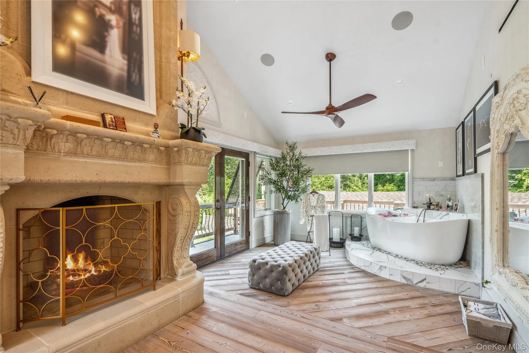 Primary bedroom with huge floor to ceiling fireplace Primary bedroom with huge floor to ceiling fireplace