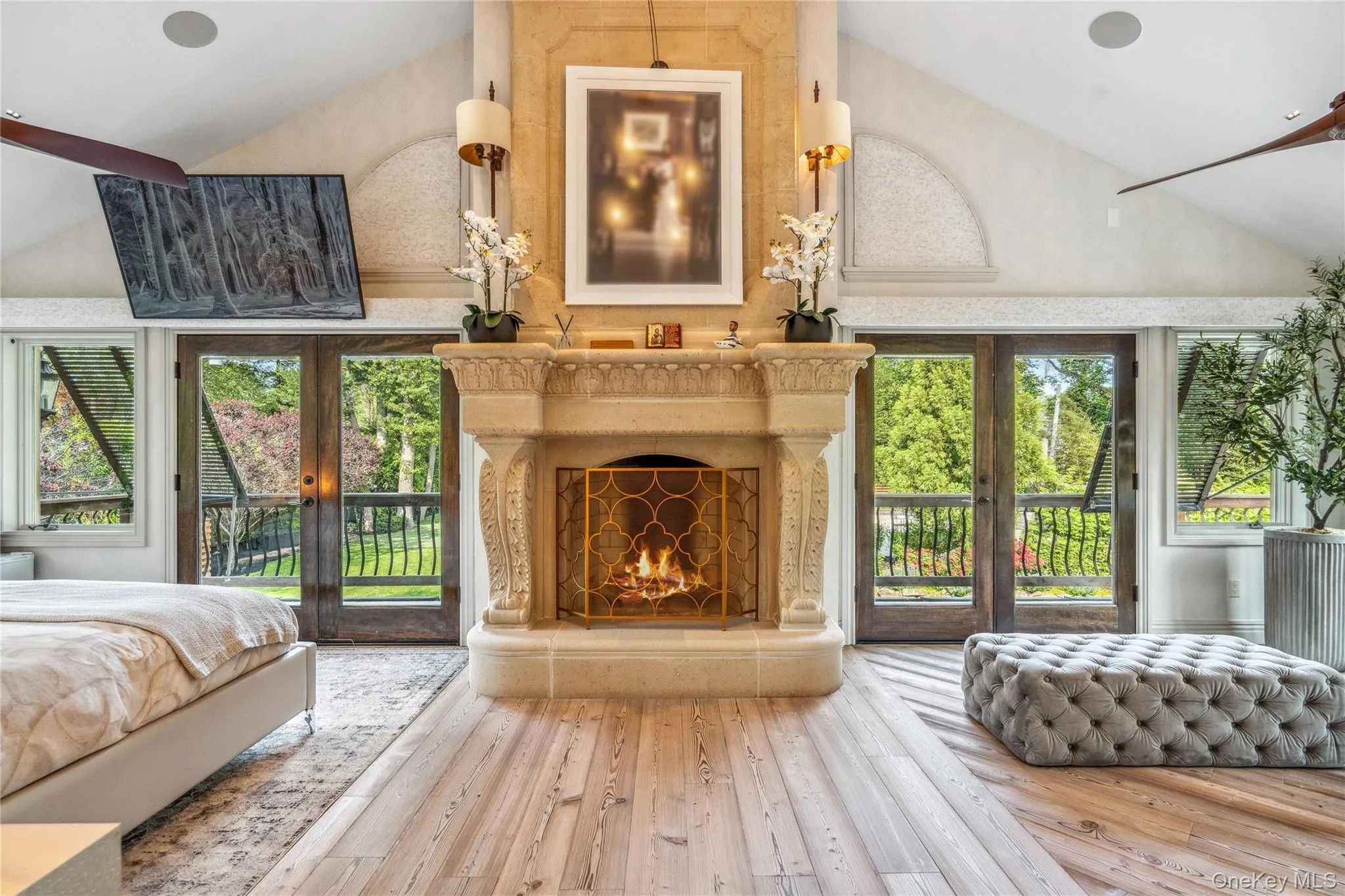 Primary bedroom with stunning floor-to-ceiling fireplace, vaulted ceiling with mini led lights Primary bedroom with stunning floor-to-ceiling fireplace, vaulted ceiling with mini led lights