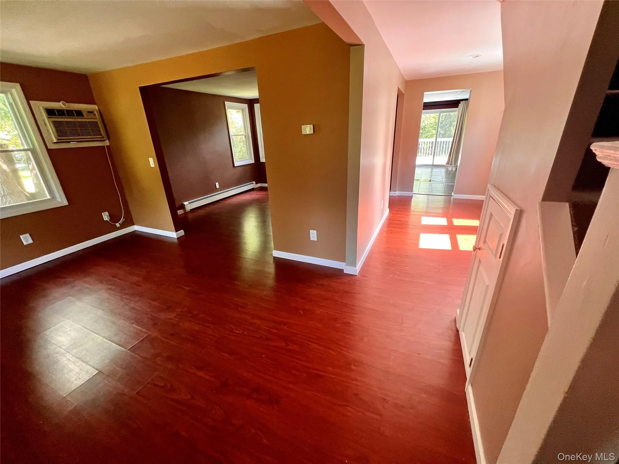 Spacious main-level living area with hardwood-style flooring and plenty of natural light. Spacious main-level living area with hardwood-style flooring and plenty of natural light.
