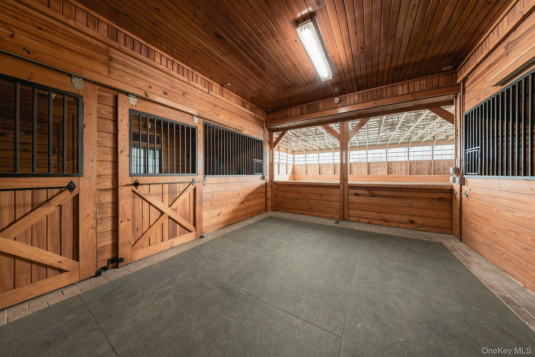 A second view of the entrance to the indoor arena with one set of doors open. A second view of the entrance to the indoor arena with one set of doors open.