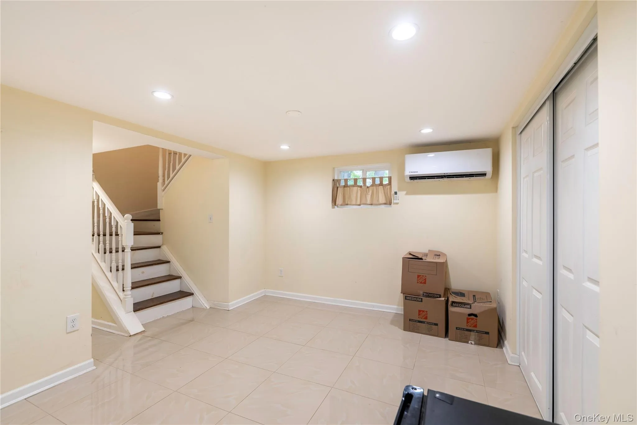 Lower level with marble floors and split system Lower level with marble floors and split system