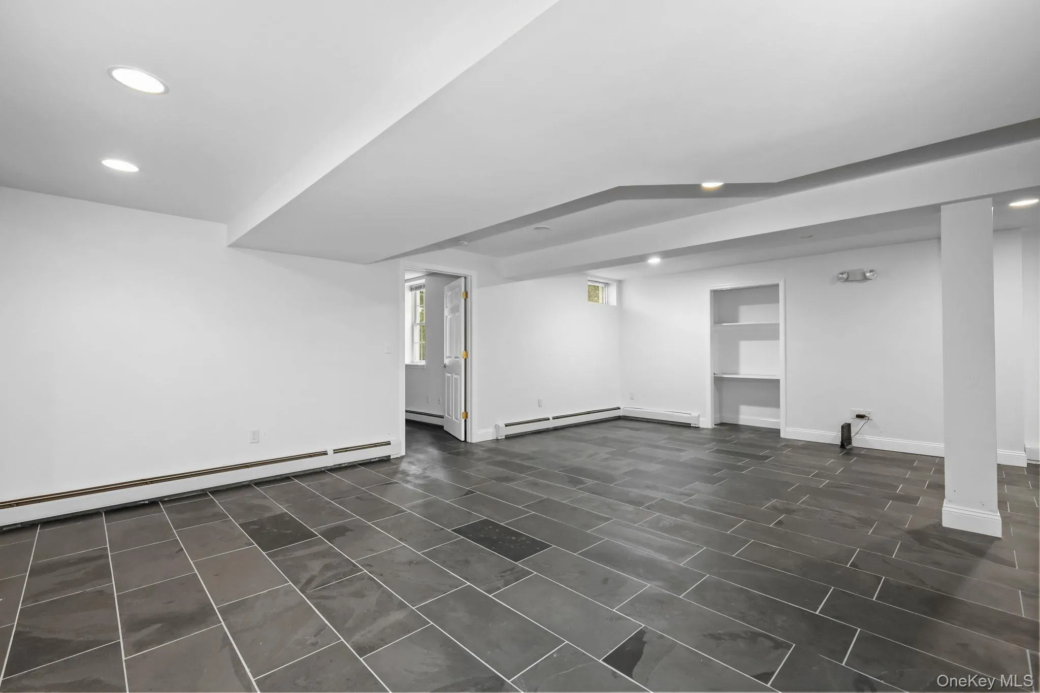Another view of the lower level. There is an Atrium door to the rear patio and a large storage room. Another view of the lower level. There is an Atrium door to the rear patio and a large storage room.