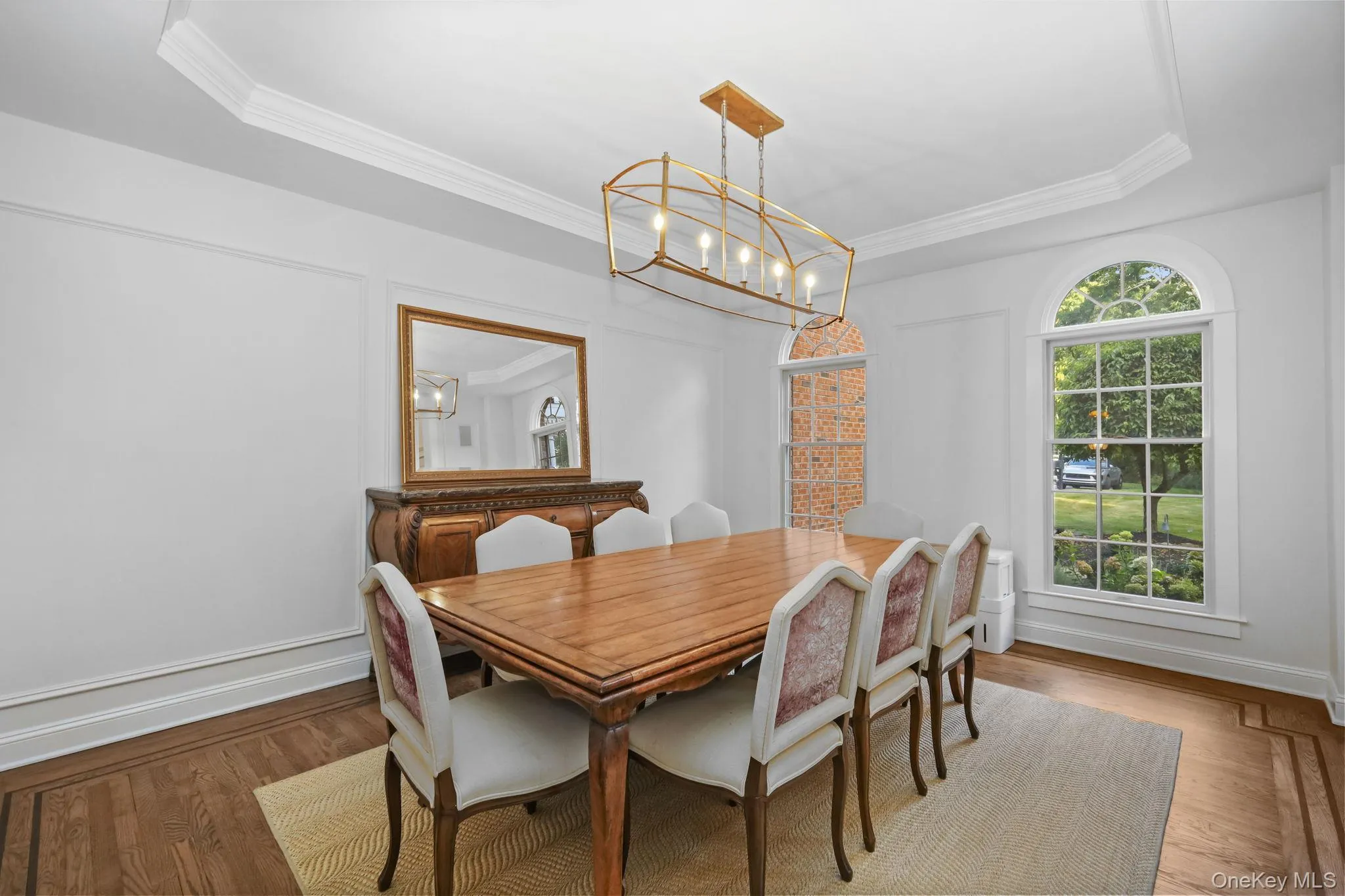 The dining room boasts a recessed ceiling, custom lighting and elegant moldings. The dining room boasts a recessed ceiling, custom lighting and elegant moldings.