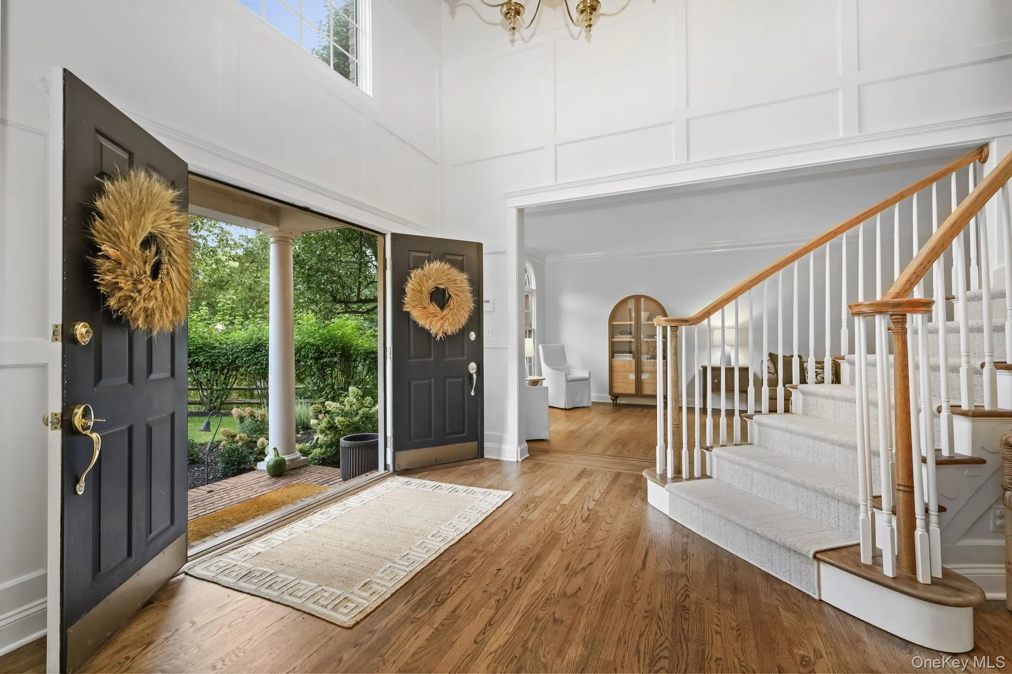 Grand entry foyer introduces the interior of this wonderful home. Notice the gleaming hardwood floors and custom millwork. Grand entry foyer introduces the interior of this wonderful home. Notice the gleaming hardwood floors and custom millwork.