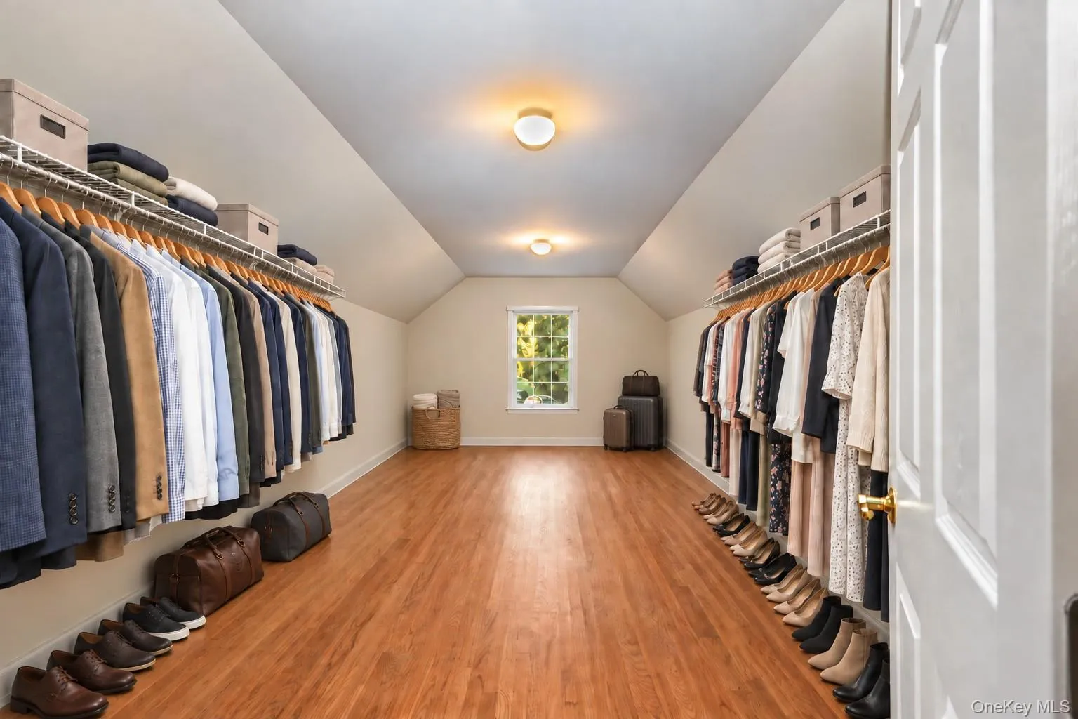 Virtually staged huge primary closet. Virtually staged huge primary closet.