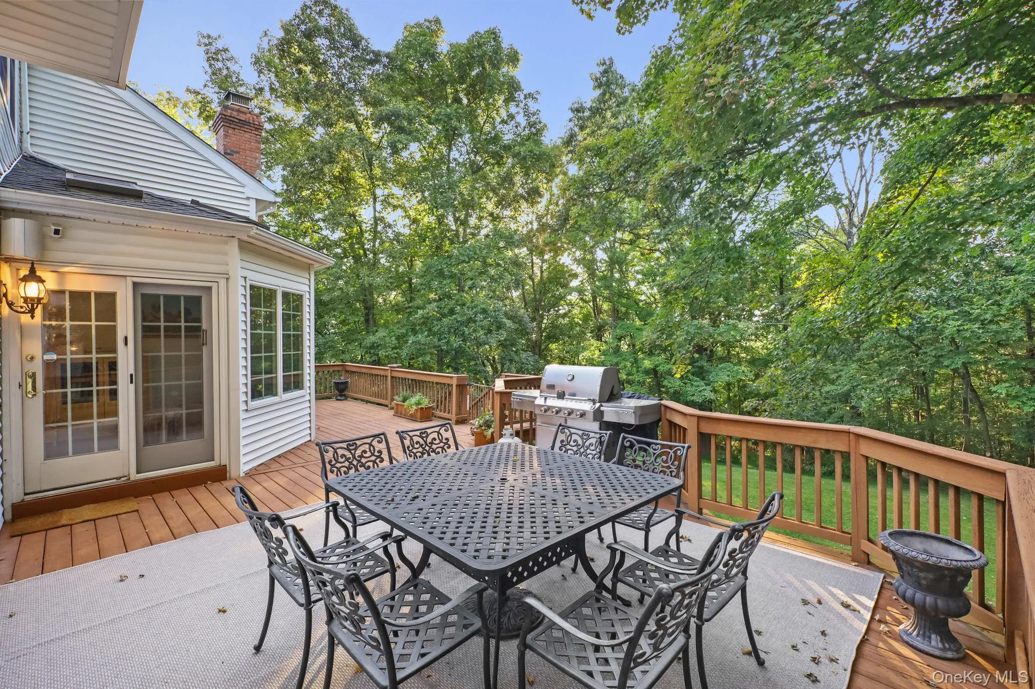 The large rear deck is accessed from the sun room. The large rear deck is accessed from the sun room.