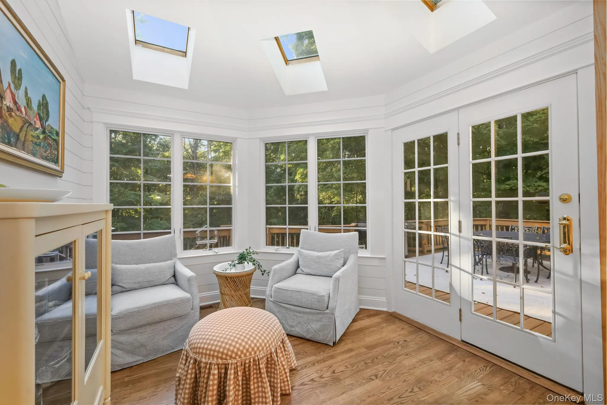 Enjoy your morning coffee in the sunroom which is flooded with natural light from the abundance of windows and skylights. There is also a door to the deck. Enjoy your morning coffee in the sunroom which is flooded with natural light from the abundance of windows and skylights. There is also a door to the deck.