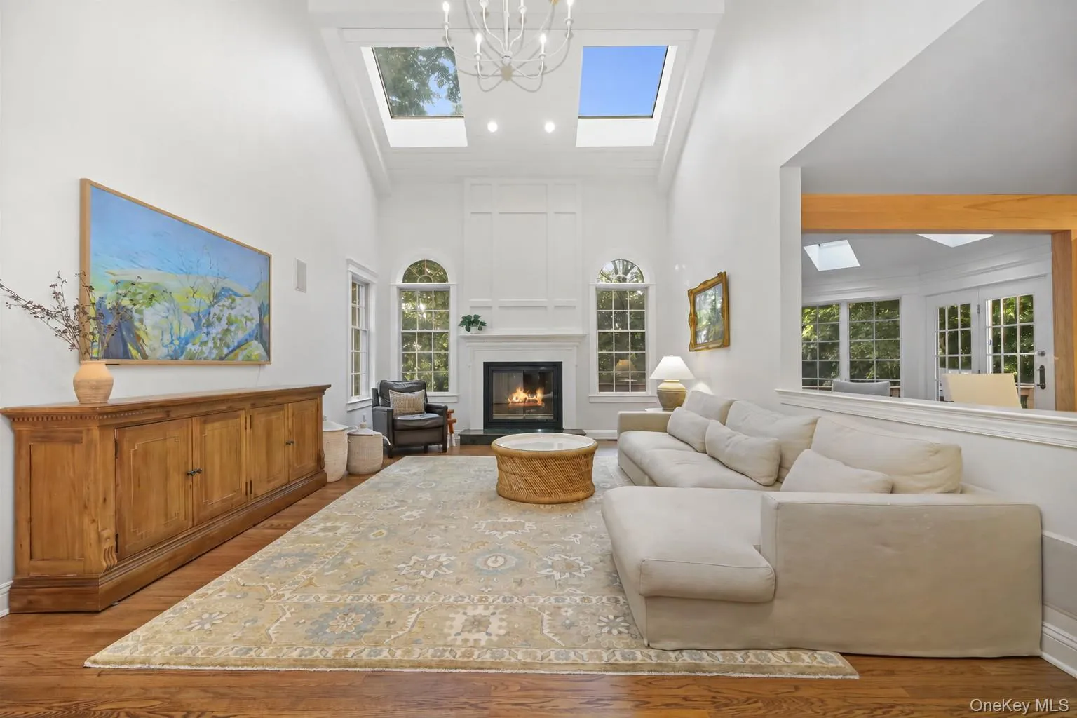 The fireplace framed by two Palladian windows is the focal point of the family room. The fireplace framed by two Palladian windows is the focal point of the family room.