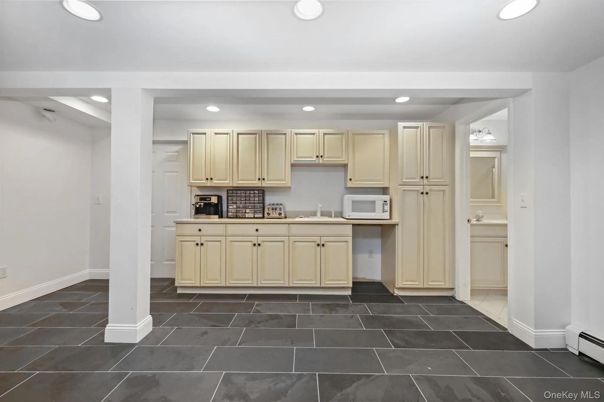 The lower level offers a kitchenette, large playroom, full bathroom and guest room. The lower level offers a kitchenette, large playroom, full bathroom and guest room.