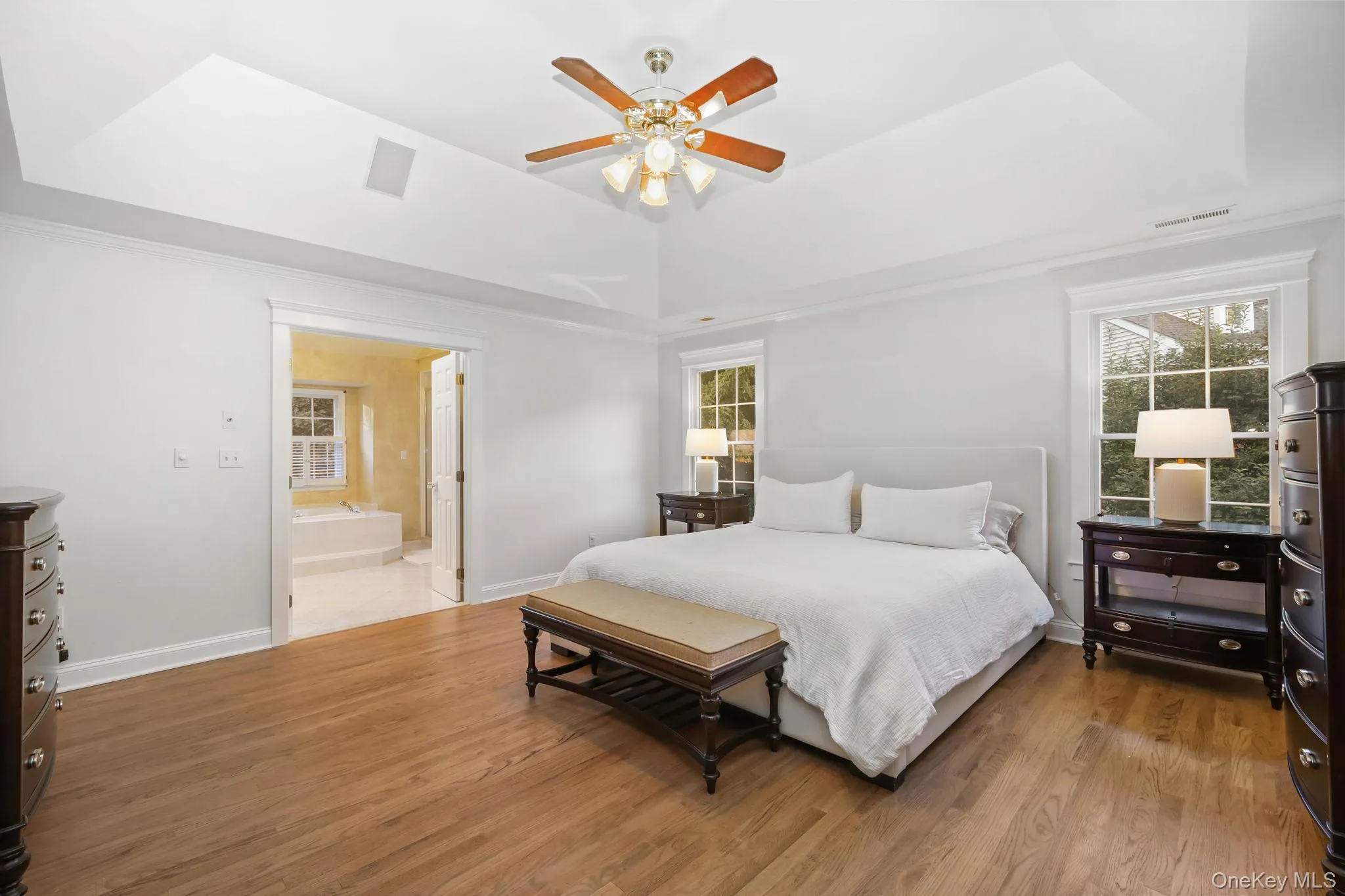 The primary bedroom is your comfortable space. Some architectural details include the tray ceiling and custom moldings. The primary bedroom is your comfortable space. Some architectural details include the tray ceiling and custom moldings.