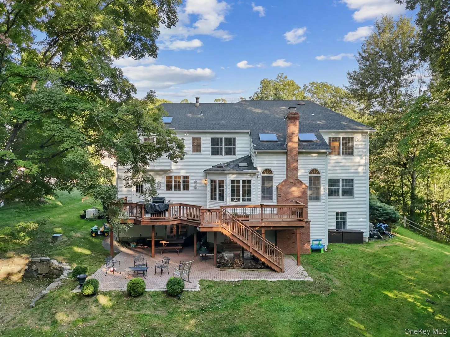 The rear deck, stone patio and expansive lawn area provide wonderful areas for entertaining friends. The rear deck, stone patio and expansive lawn area provide wonderful areas for entertaining friends.