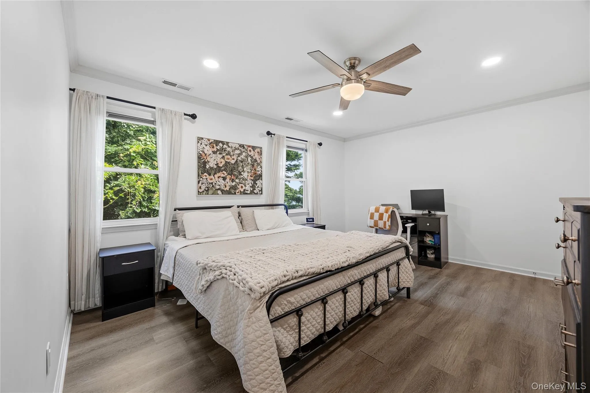 New vinyl plank flooring, crown molding, recessed lighting and a ceiling fan were all recent upgrades to add to the beauty and comfort of this space. New vinyl plank flooring, crown molding, recessed lighting and a ceiling fan were all recent upgrades to add to the beauty and comfort of this space.
