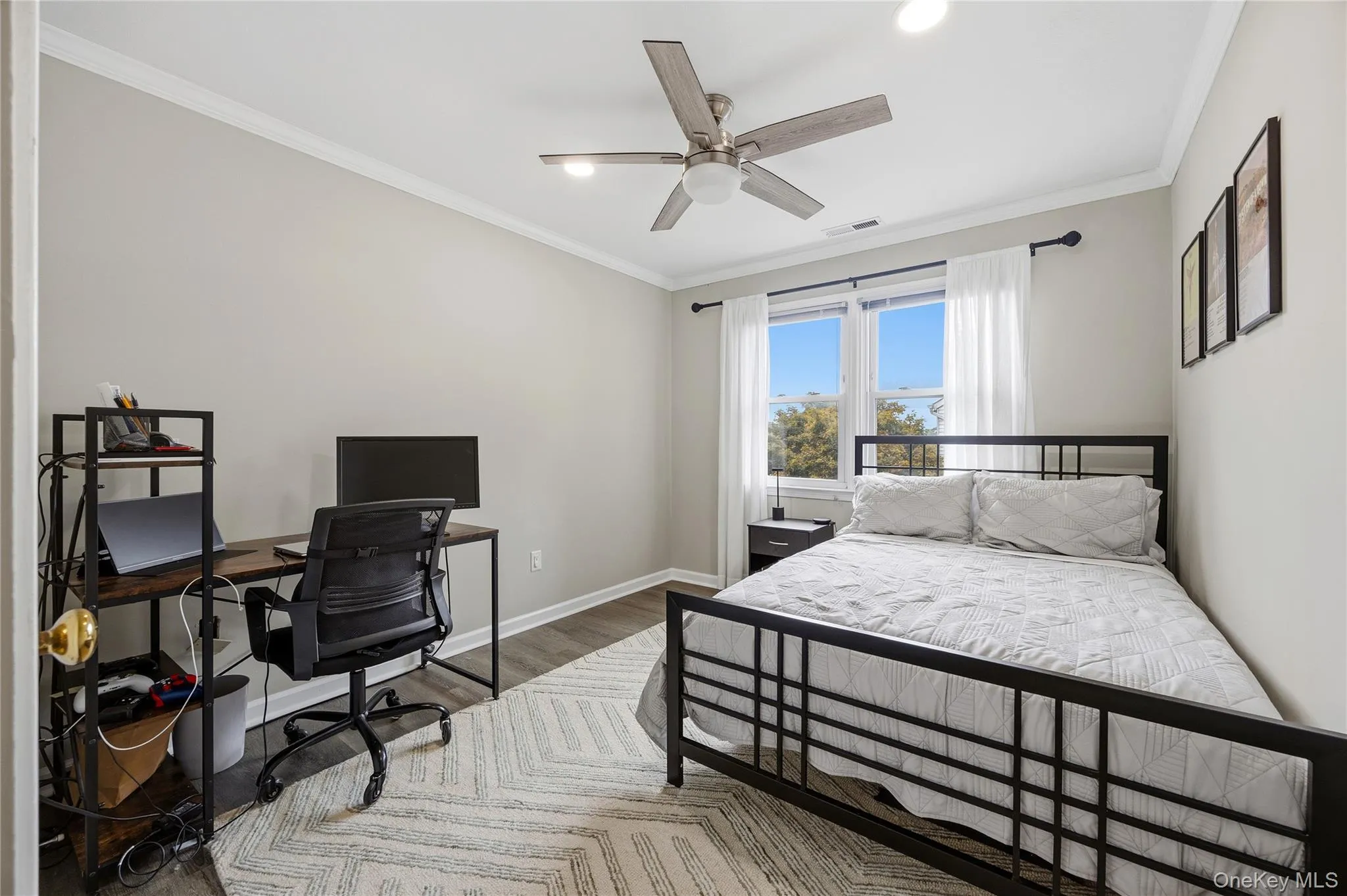 Bedroom 3 nearly measures 10' X 12' and also features several updates including a ceiling fan, crown molding, vinyl plank flooring and recessed lighting. Bedroom 3 nearly measures 10' X 12' and also features several updates including a ceiling fan, crown molding, vinyl plank flooring and recessed lighting.