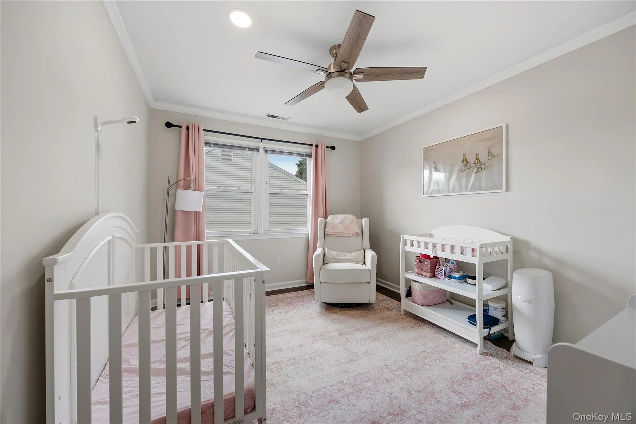 The second bedroom has been updated to include a ceiling fan, crown molding, recessed lighting and vinyl plank flooring. The second bedroom has been updated to include a ceiling fan, crown molding, recessed lighting and vinyl plank flooring.