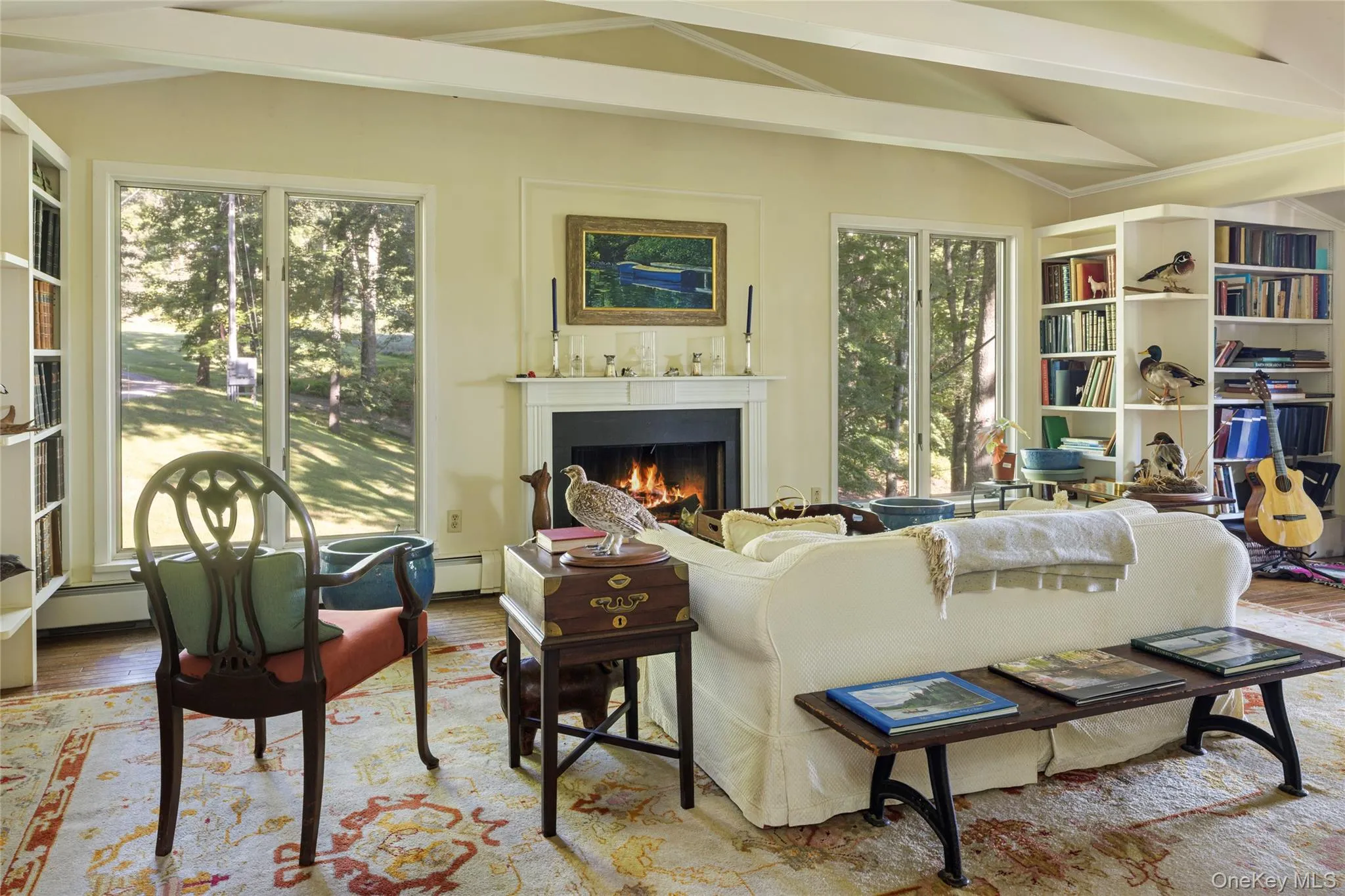 Light-filled with fireplace and hardwood floors. Leads to deck. Light-filled with fireplace and hardwood floors. Leads to deck.