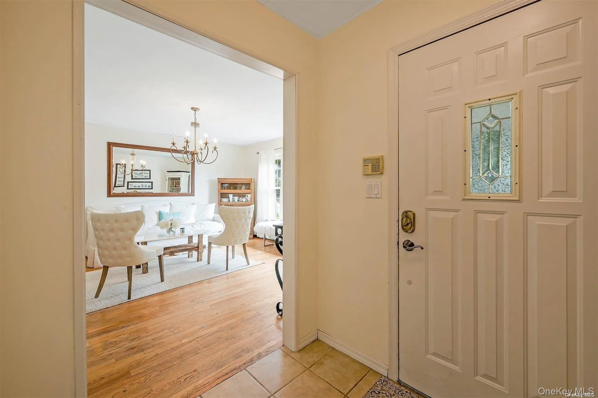 Paneled entry door with decorative glass inlay Paneled entry door with decorative glass inlay