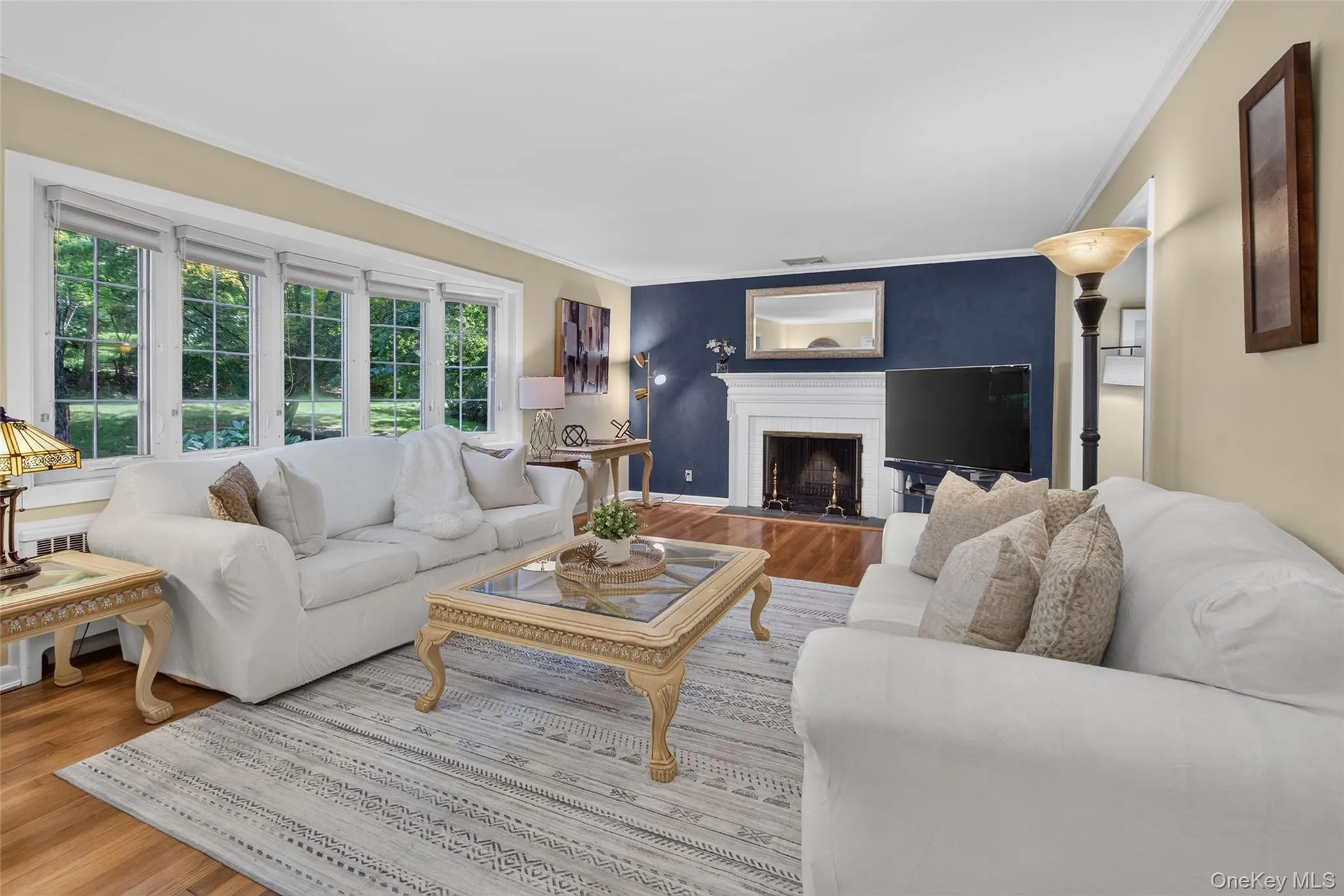 Large living room with bay window and wood buring fireplace Large living room with bay window and wood buring fireplace